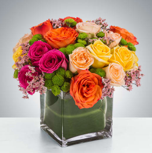 Kaleidoscope by BloomNation™ - A full-color explosion, Kaleidoscope by BloomNation™ is a beautiful gift for anybody you want to impress. Mother-in-law, your boss, a client, etc... this arrangement is a crowd pleaser and an eye-catcher.  Approximate Dimensions: 14"D x 14"H