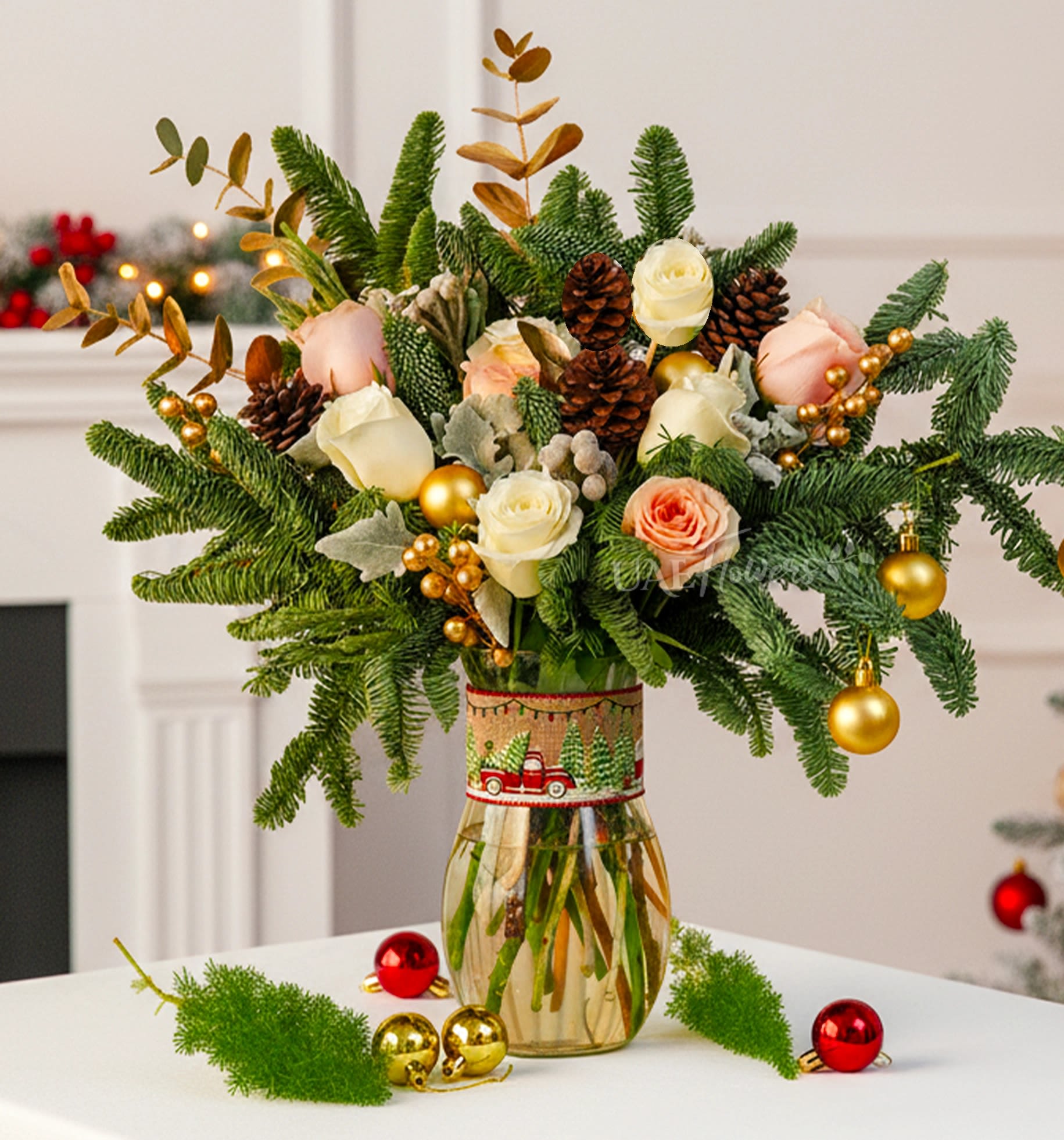 Natural Beauty Arrangement  -   Illuminate your holiday season with this sophisticated vase arrangement that blends natural beauty with festive sparkle. This elegant display features a harmonious mix of creamy white and soft peach roses, nestled within a lush bed of fresh seasonal pine branches and silvery dusty miller leaves. Accented with shimmering gold baubles, golden berry sprigs, and rustic pine cones, the arrangement is presented in a clear glass vase decorated with a charming holiday-themed ribbon band. It is a perfect ready-to-display centerpiece for your dining table or a refined gift for colleagues and loved ones. 