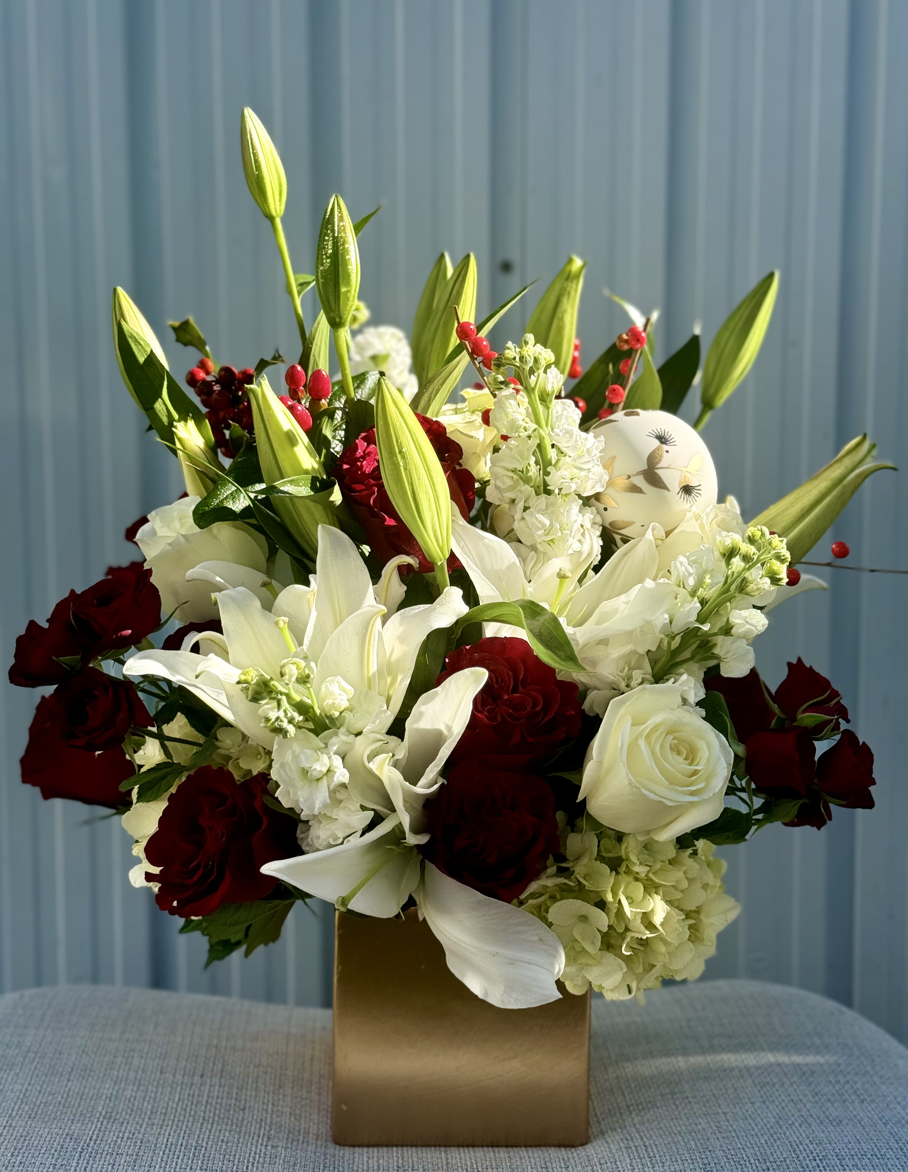 IT’S A WONDERFUL LIFE - The holidays are a special time to reconnect with family. This beautiful design with roses and Lilly’s and beautiful touches of the holiday remind them of just how much they mean to you…