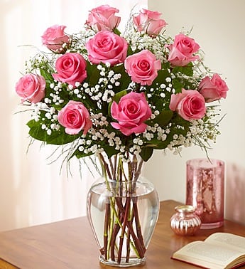 Doz Pink Roses - Product ID: 90055 Long-stem pink roses are just the gift when you want to express yourself with all the grace, sophistication and elegance they deserve--and more. Give fresh romance and passion with this beautiful, hand-crafted arrangement of premium long-stem pink roses. Our florists select the finest, freshest long-stem pink roses and arrange them by hand with fresh gypsophila in a classic glass vase 
