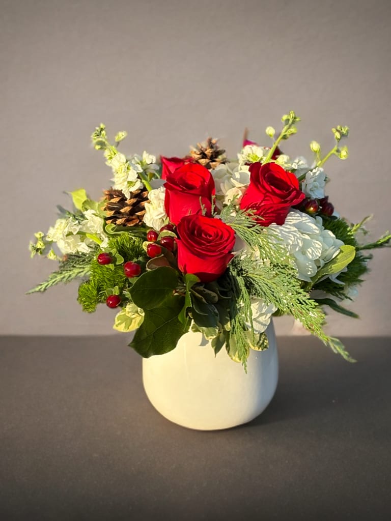 Peppermint  - Beautiful red roses accented with white hydrangea and winter greens 