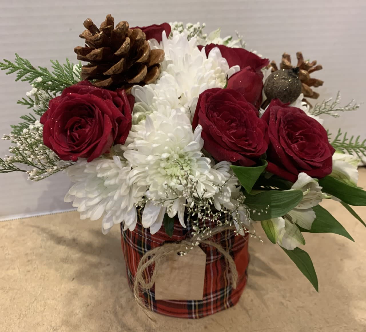 Merry - Send your best wishes for a Merry Christmas with this delightful arrangement.  "Merry" has just the right touch of Christmas spirit with red, white and green flowers and all the perfect finishing touches. Regular and Deluxe (with tall red berries) shown.