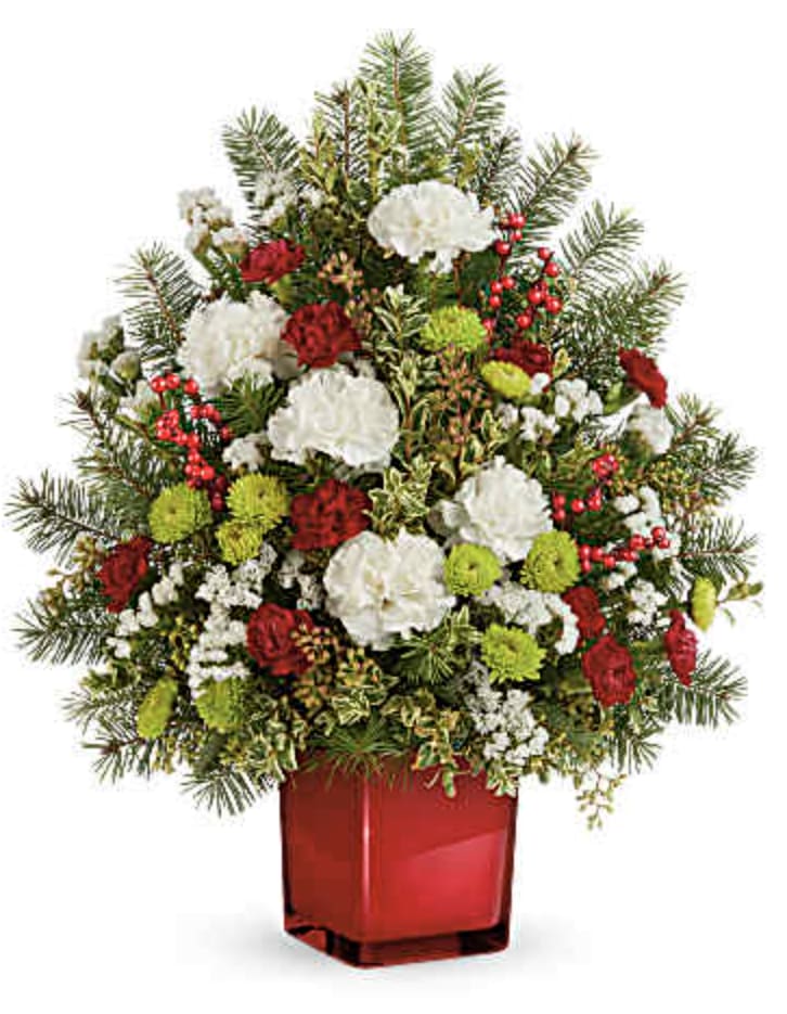 Radiant Winter Tree - Delight loved ones with festive season's greetings through our charming mini tabletop Christmas tree. Adorned with Christmas flowers and greens in a scarlet color splash cube, it's the perfect holiday gift to spread joy.