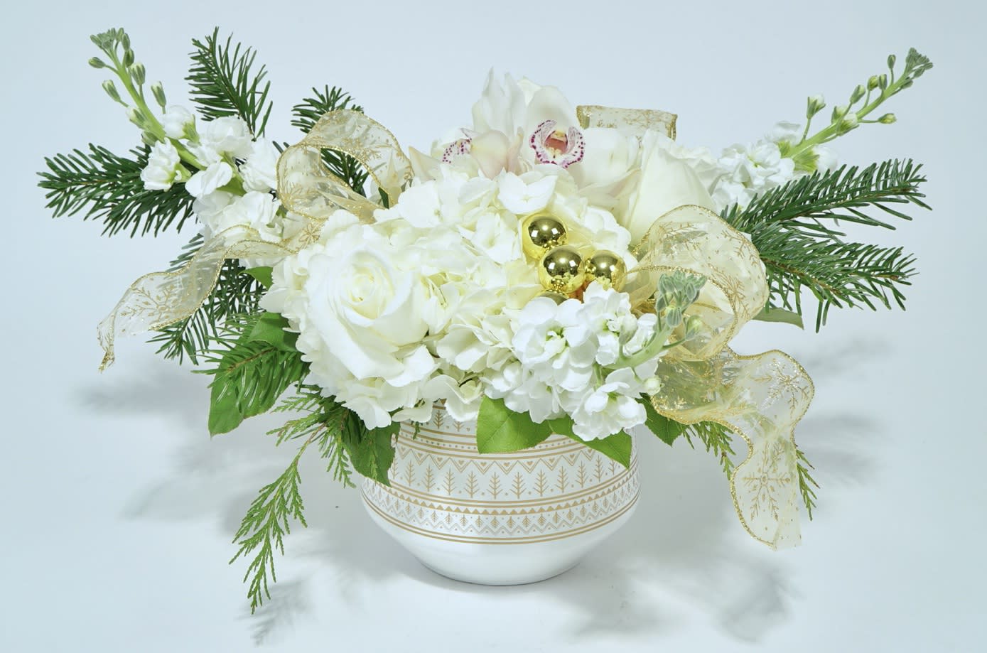 White Christmas  - Inspired by Bing Crosby's &quot;White Christmas&quot; this arrangement boasts glistening roses, hydrangea, stock, and large cymbidium orchids for a Floridian winter holiday.  