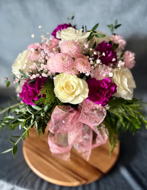 BLUSH BLOSSOMS - Welcome to our "Blush Blossoms" a captivating flower arrangement where the delicate allure of pink and white blooms dances in perfect unity. Immerse yourself in the ethereal beauty of this bouquet, crafted to evoke feelings of grace and serenity. Let the timeless elegance of these flowers create a moment of pure enchantment.  The picture shows the standard size. 