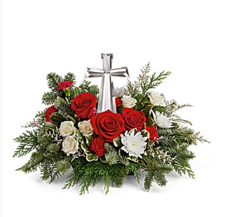 Joy of Light - The crystal cross is nestled elegantly among red and white blooms, this keepsake brings joy and light to your special occasion. Red roses, white spray roses, red miniature carnations, white cushion spray chrysanthemums are adorned with noble fir, and cedar. Delivered with a glass Cross Keepsake.