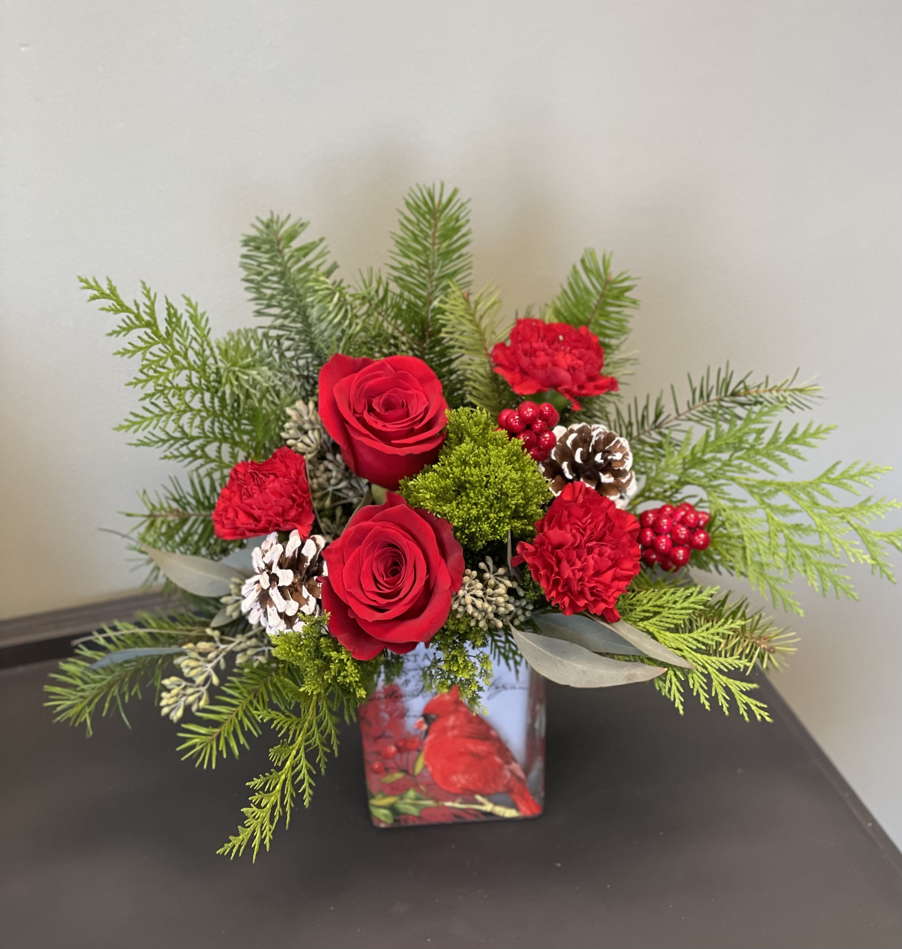 Joyful Cardinal - Deck the halls with timeless holiday style! This joyful bouquet of Christmas roses is presented in a vintage-inspired cube vase with charming winter cardinal artwork. Makes a lovely candleholder in years to come!