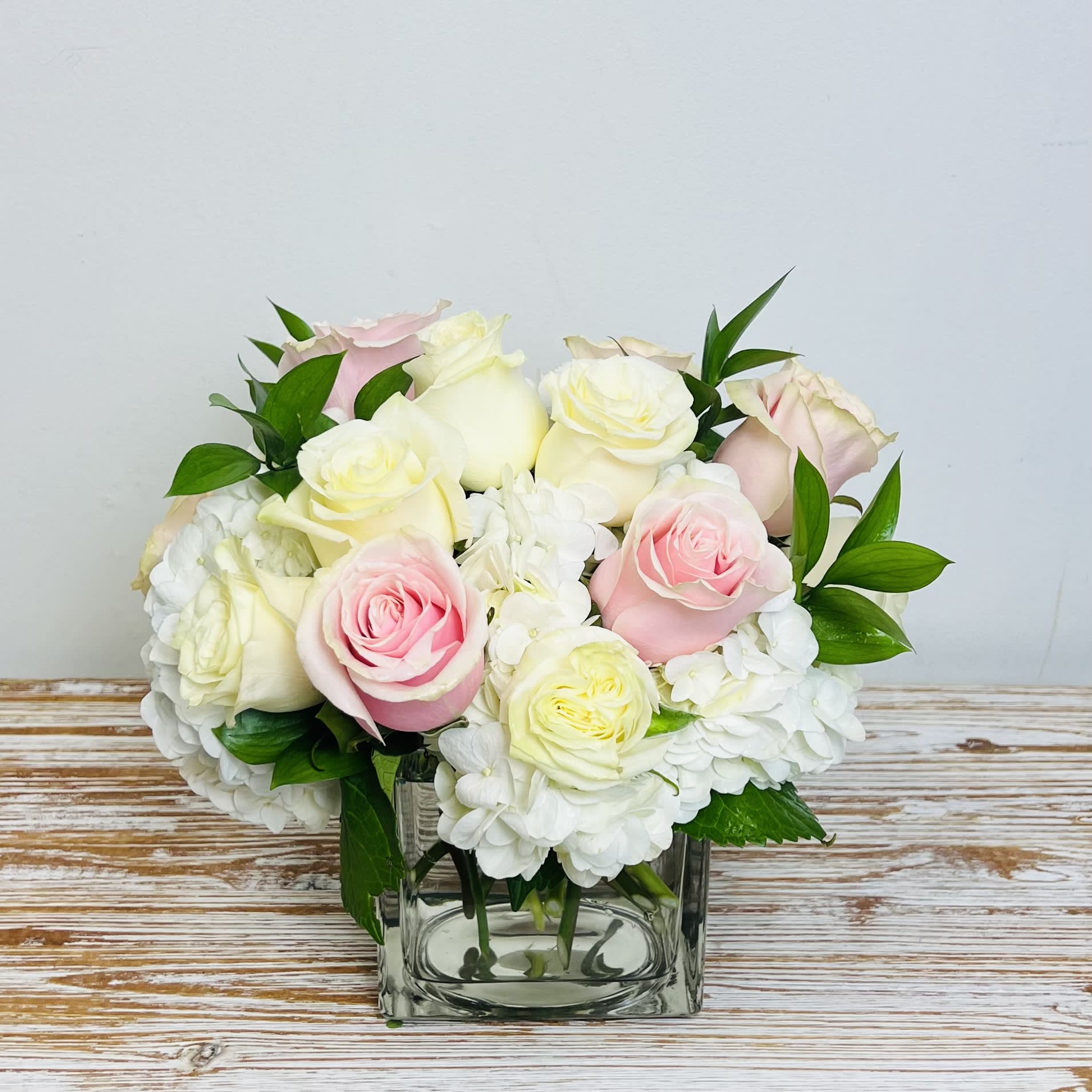 Simply Elegant - This bouquet shows that there is beauty in simplicity. Elegant is the perfect gift for almost any occasion, especially for celebrations and showing gratitude.    Approximately 10&quot; Tall x 10&quot; Wide