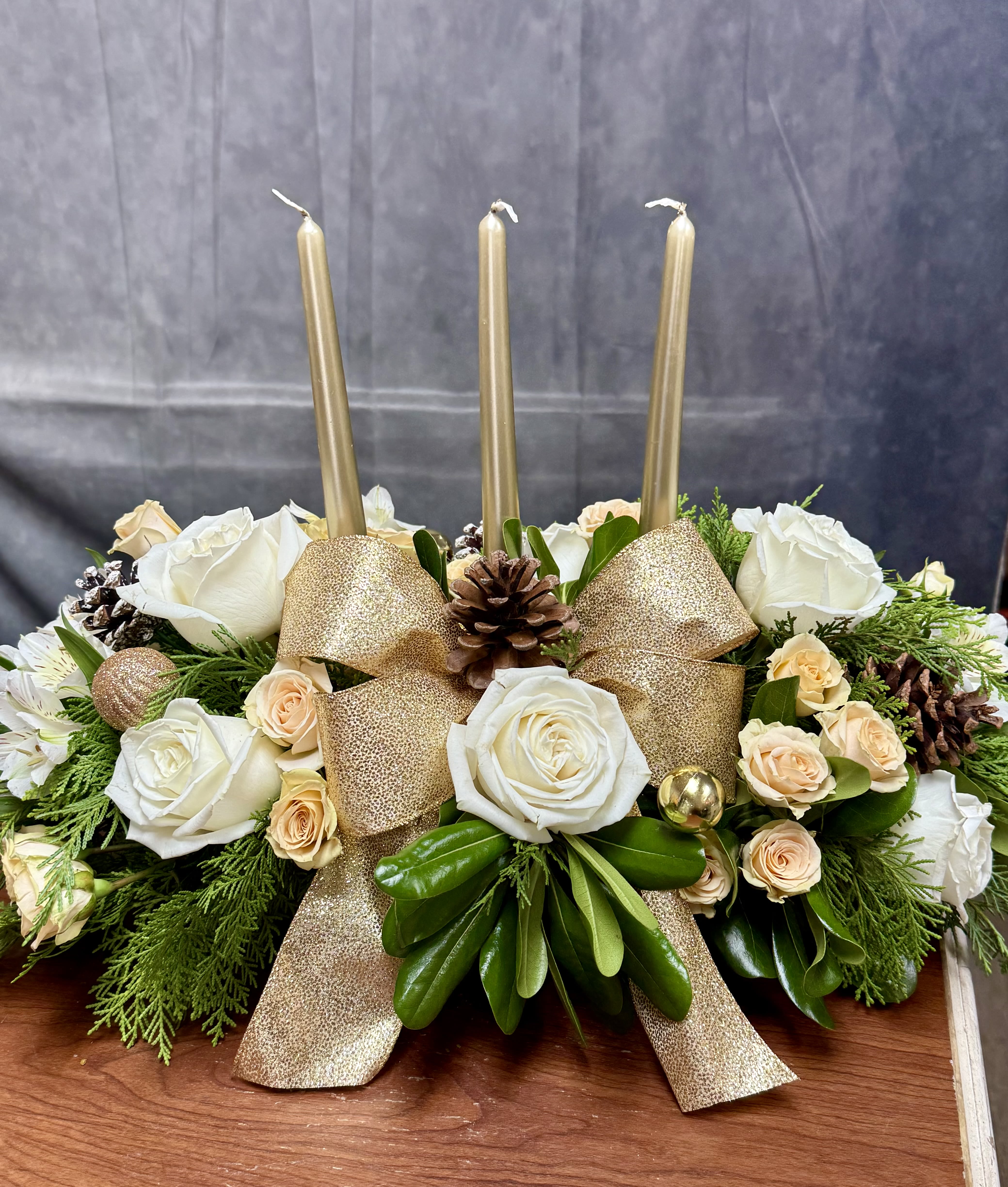 Golden Glow - Celebrate the season with the timeless beauty of Golden Glow florals! J&amp;S Floral introduces our newest Christmas-inspired designs, perfect for adding warmth and joy to your holiday celebrations. A stunning blend of pure white blooms such as lilies ,roses , mums , hydrangeas, stock paired with mix greenery and gold greenery. Each design is handcrafted with care to bring holiday cheer to your home or to gift someone special. Order now to make your Christmas unforgettable!