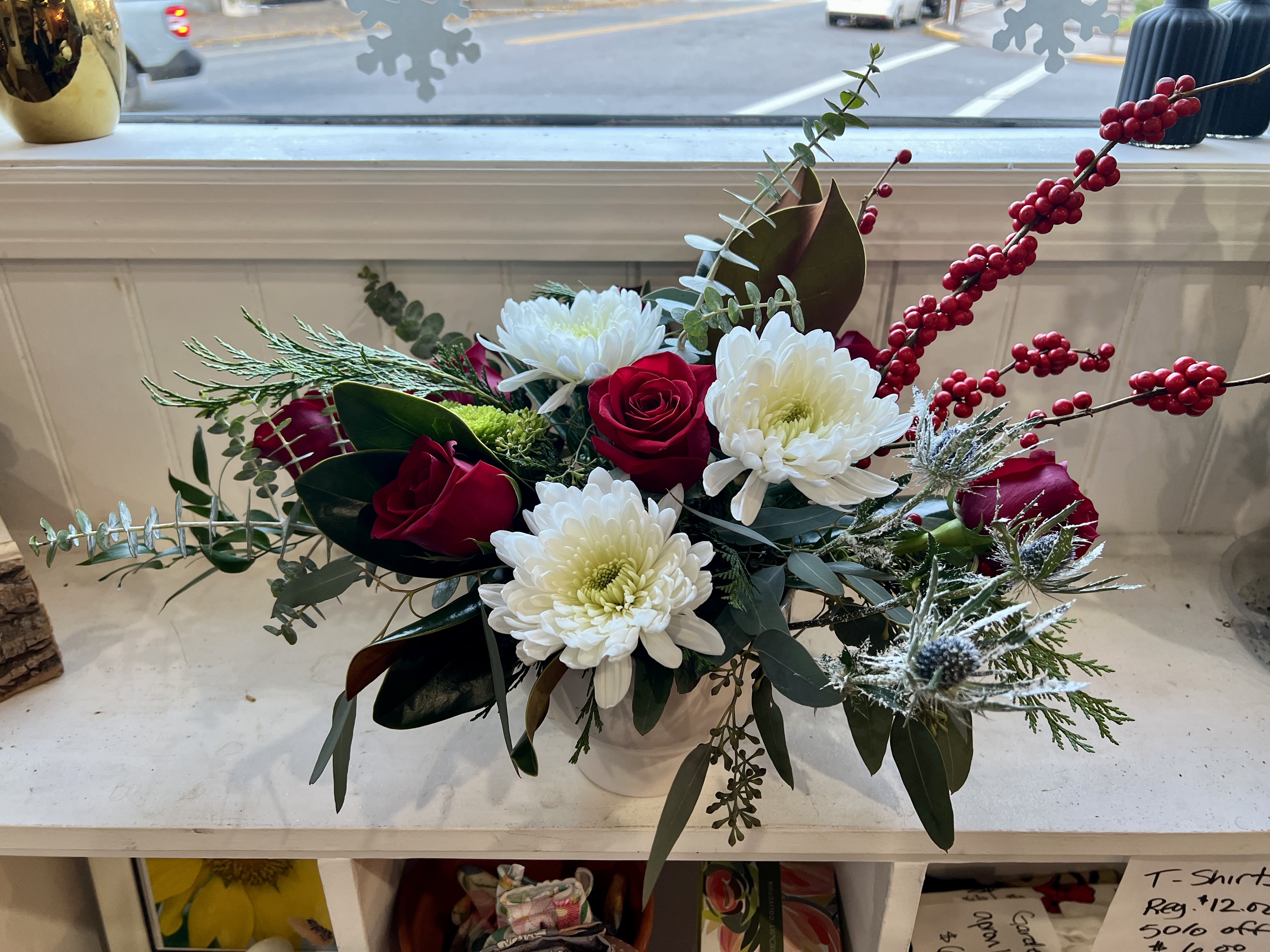 Diamonds In The Snow - This gorgeous Christmas arrangement will shine bright like a diamond everywhere it goes. It comes in a ceramic reusable vase. 