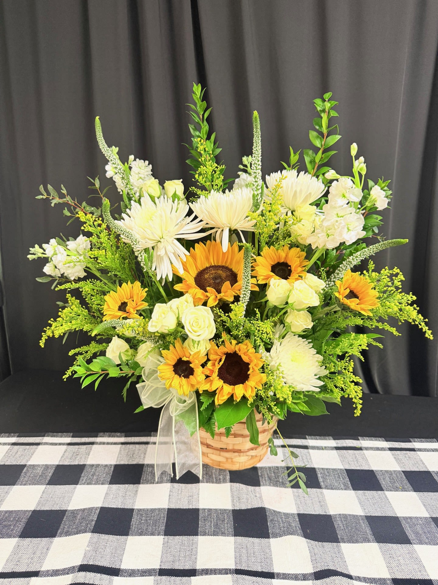 Basket of sunshine - Basket of sunshine arrangement! Send someone you care about this beautiful basket of sunshine! Includes sunflowers, chrysanthemums, veronica, spray roses, and complimenting greenery.