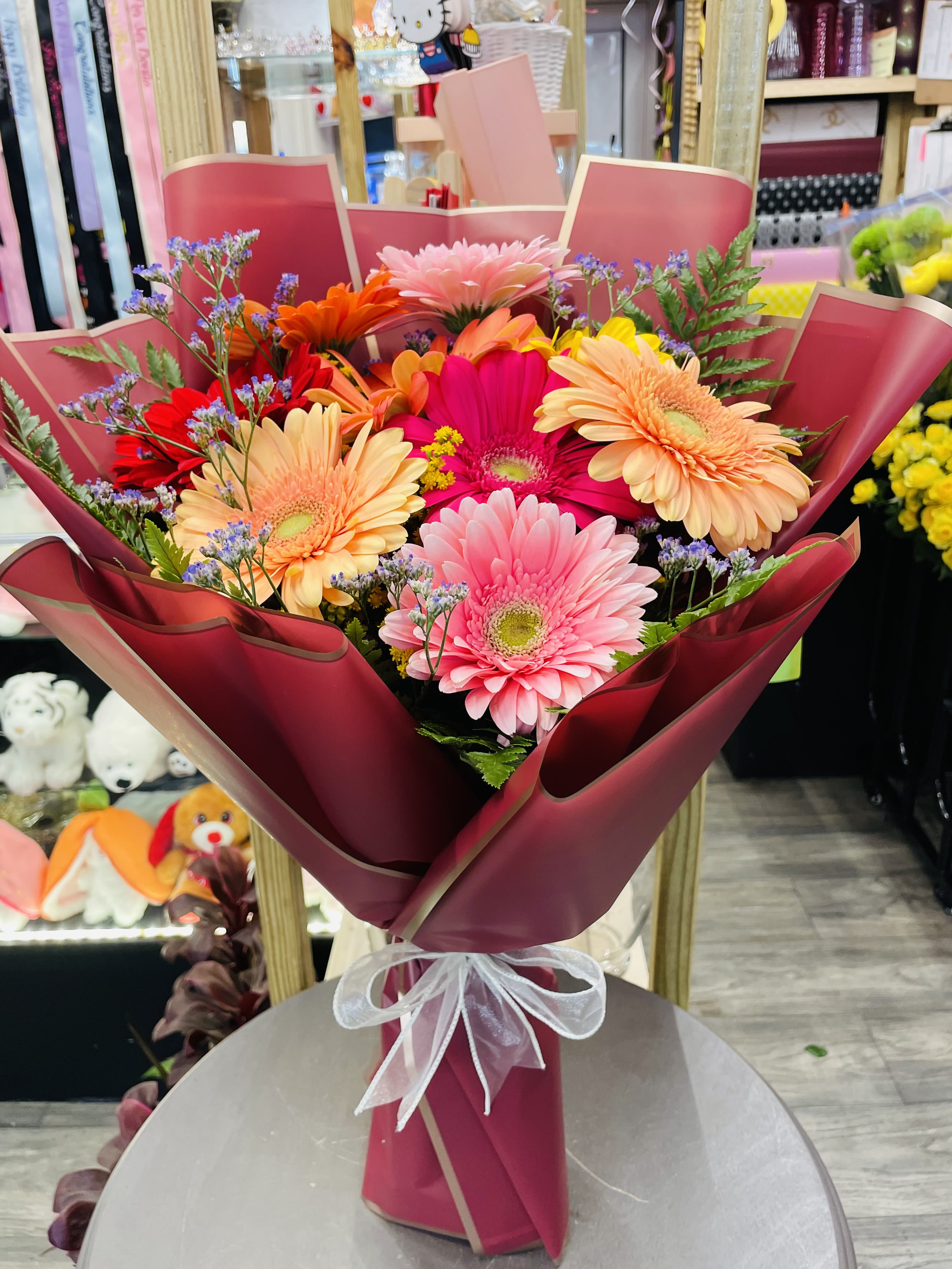 Daisy Bouquet - Looking for a non-traditional bouquet? This daisy bouquet is the perfect gift! It features all sorts of gerbera daisies and will certainly bright up someone's day. 