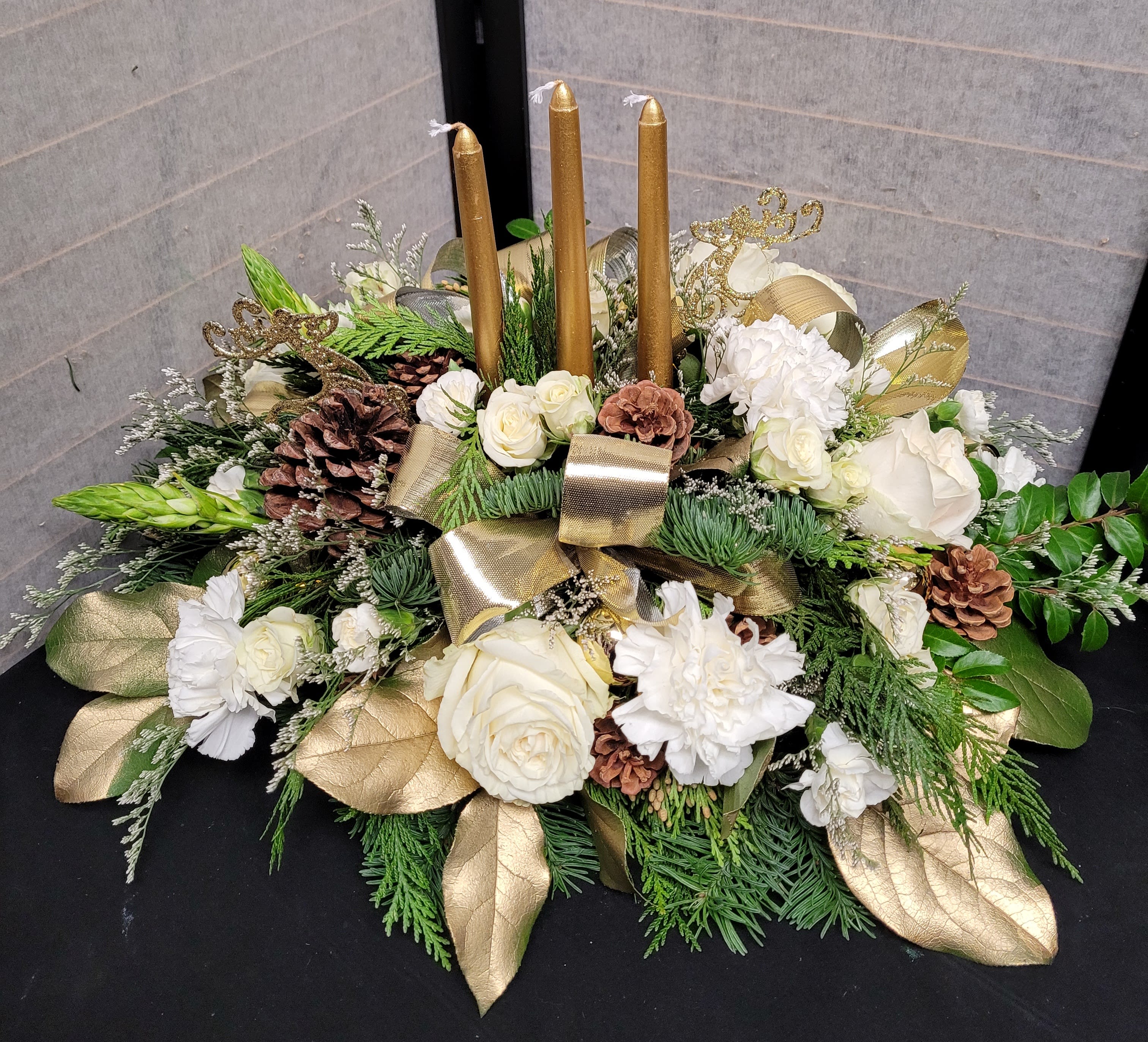 Holiday memories in gold  - A floral dinnertime companion with 2 taper candles This is a gentle, soothing, display and will give your gathering a natural scent that does not overwhelm.