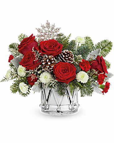 Teleflora's Little Drummer Joy Bouquet - DESCRIPTION VASE SIZES Teleflora's Little Drummer Joy Bouquet marches in the holiday cheer with red roses, wintery greens, and festive white blooms in Teleflora's keepsake Crystal Drum Vase.  Teleflora's Little Drummer Joy Bouquet includes red roses, red miniature carnations, white button spray chrysanthemums, and white limonium. Accented with cedar, dusty miller, and noble fir in Teleflora's Crystal Drum Vase Orientation: All-Around  SUBSTITUTION POLICY – Always deliver the freshest flowers! Please note the bouquet pictured reflects our original design.  If the exact flowers or container in this arrangement are not available, our local florists will create a beautiful bouquet with the freshest available flowers. 
