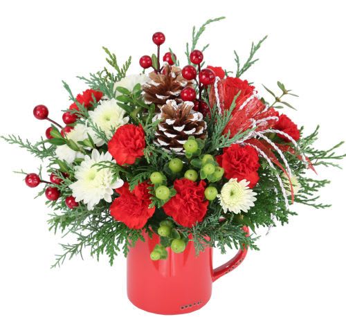 festive holiday mug  - A warm gift of a festive holiday mug that they can use over and over again! Filled to the brim with red mini carnations, white mums, frosted pinecones, berries, and a holiday bow!