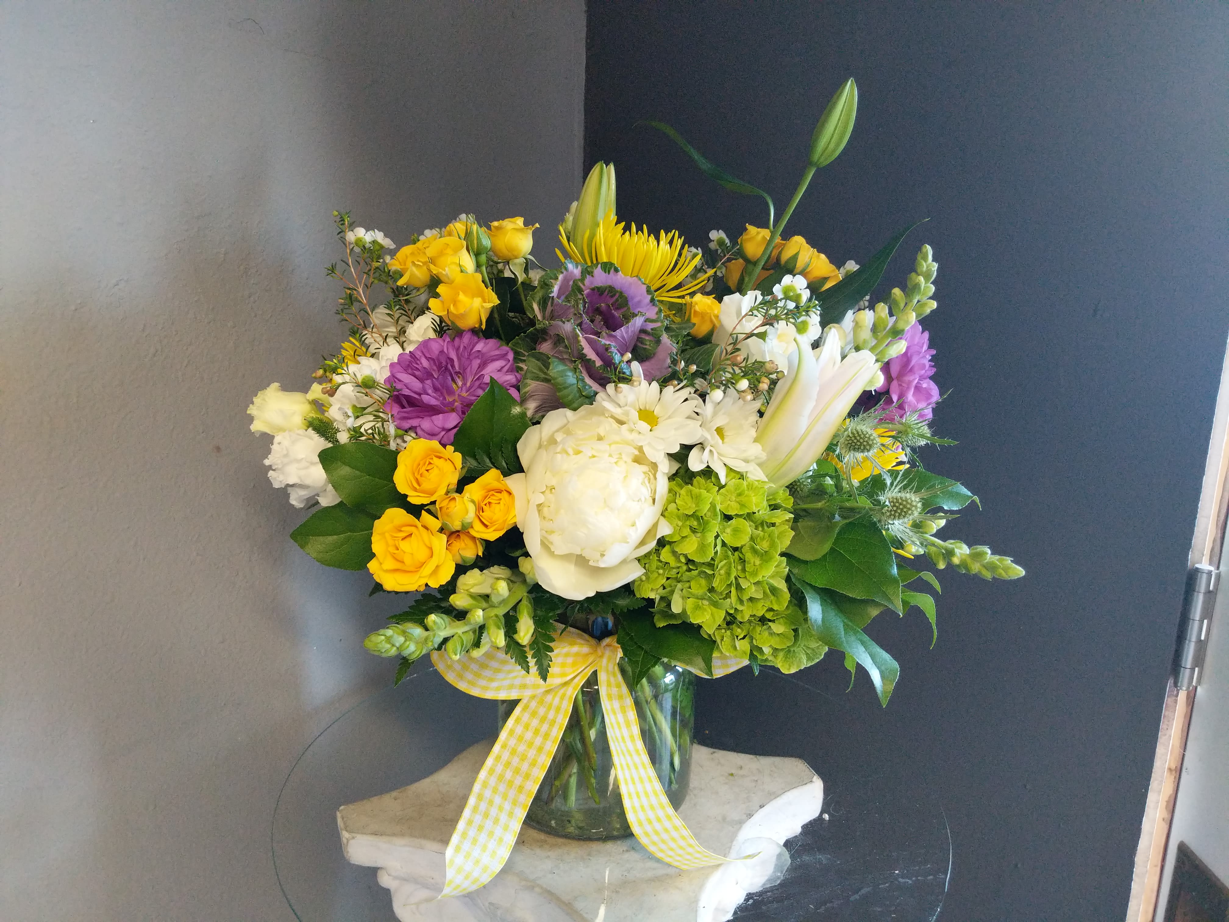 # 143 Winter Floral Arrangement  - A beautifully selected bunch of the freshest flowers in a vase uniquely arranged by hand.