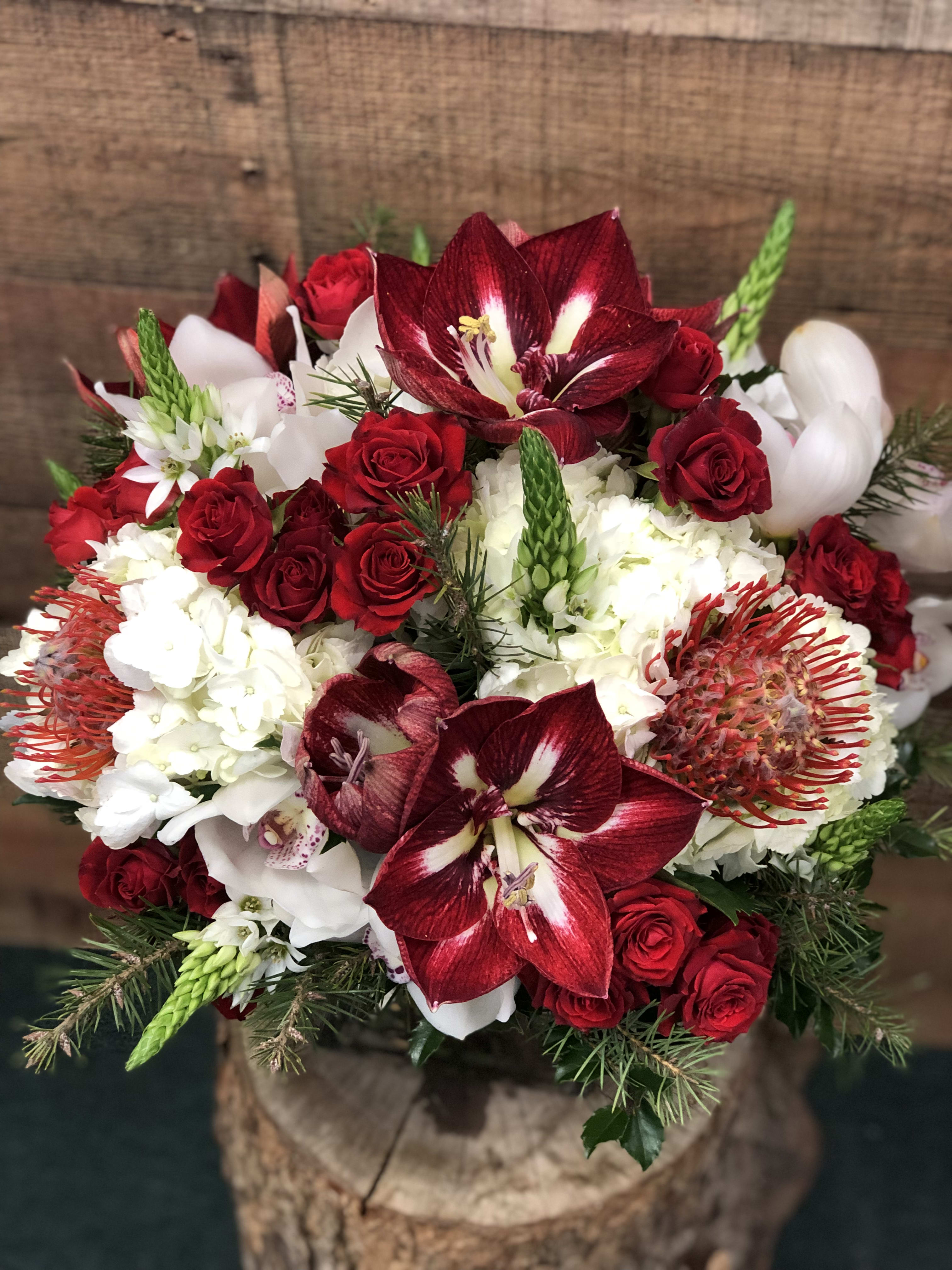 Premier Choice - Let our top designers provide the best the season has to offer. Hand selected blooms skillfully designed with a modern flair.