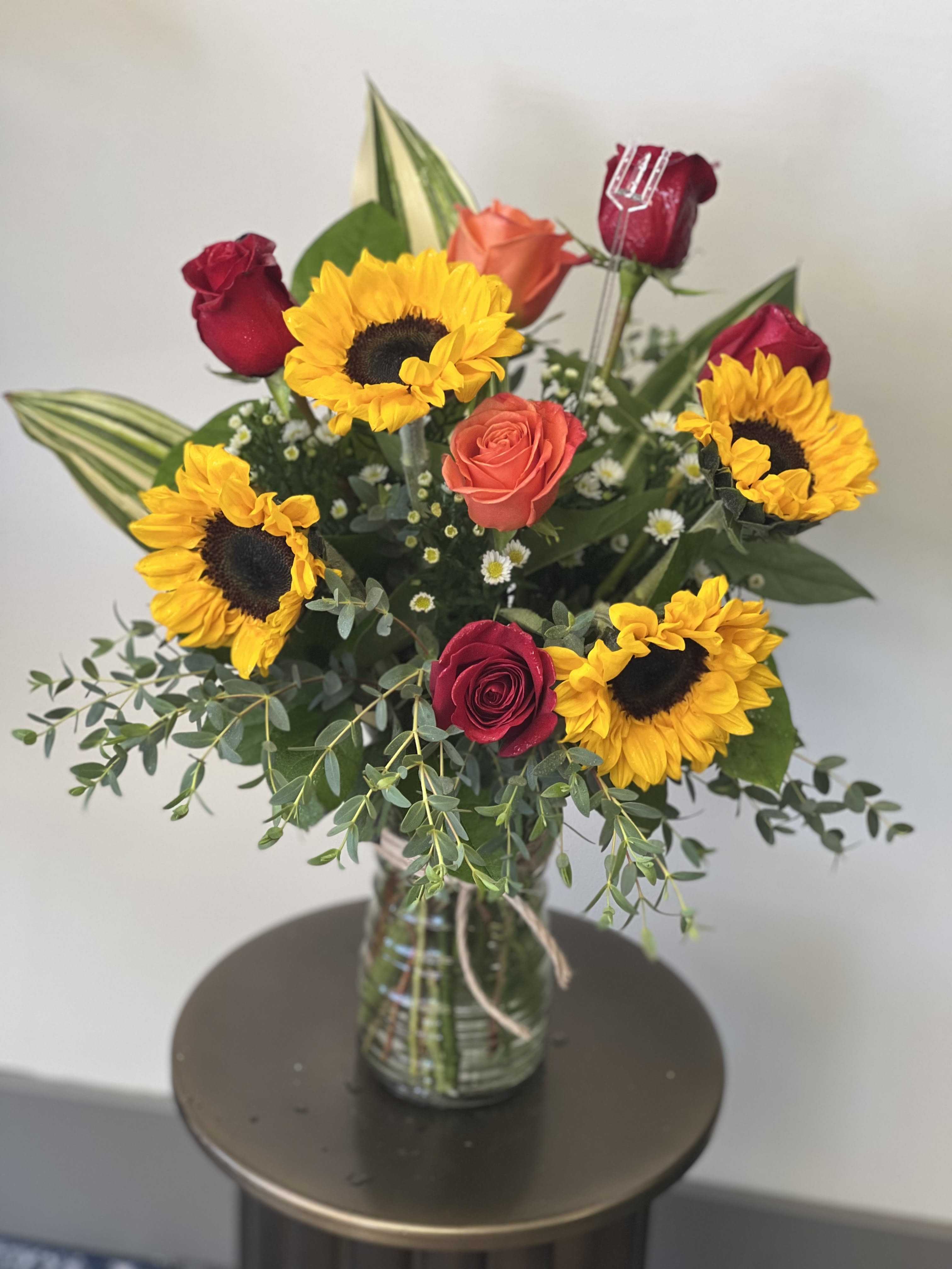 You Are My Sunshine  - Bright and cheery with sunflowers, red roses and orange roses. 