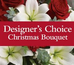 Christmas Themed Designer's Choice - A Christmas themed bouquet curated by one of our floral designers! Feel free to request any specifics you'd like included in Special Instructions.