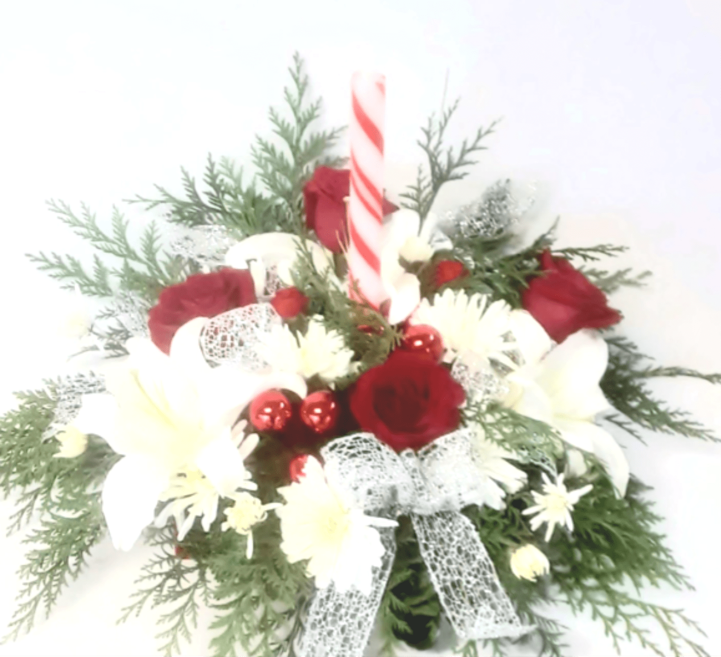 Happy Christmas Centerpiece with Lilies - A beautiful centerpiece for the holidays with roses, a candle and white lilies