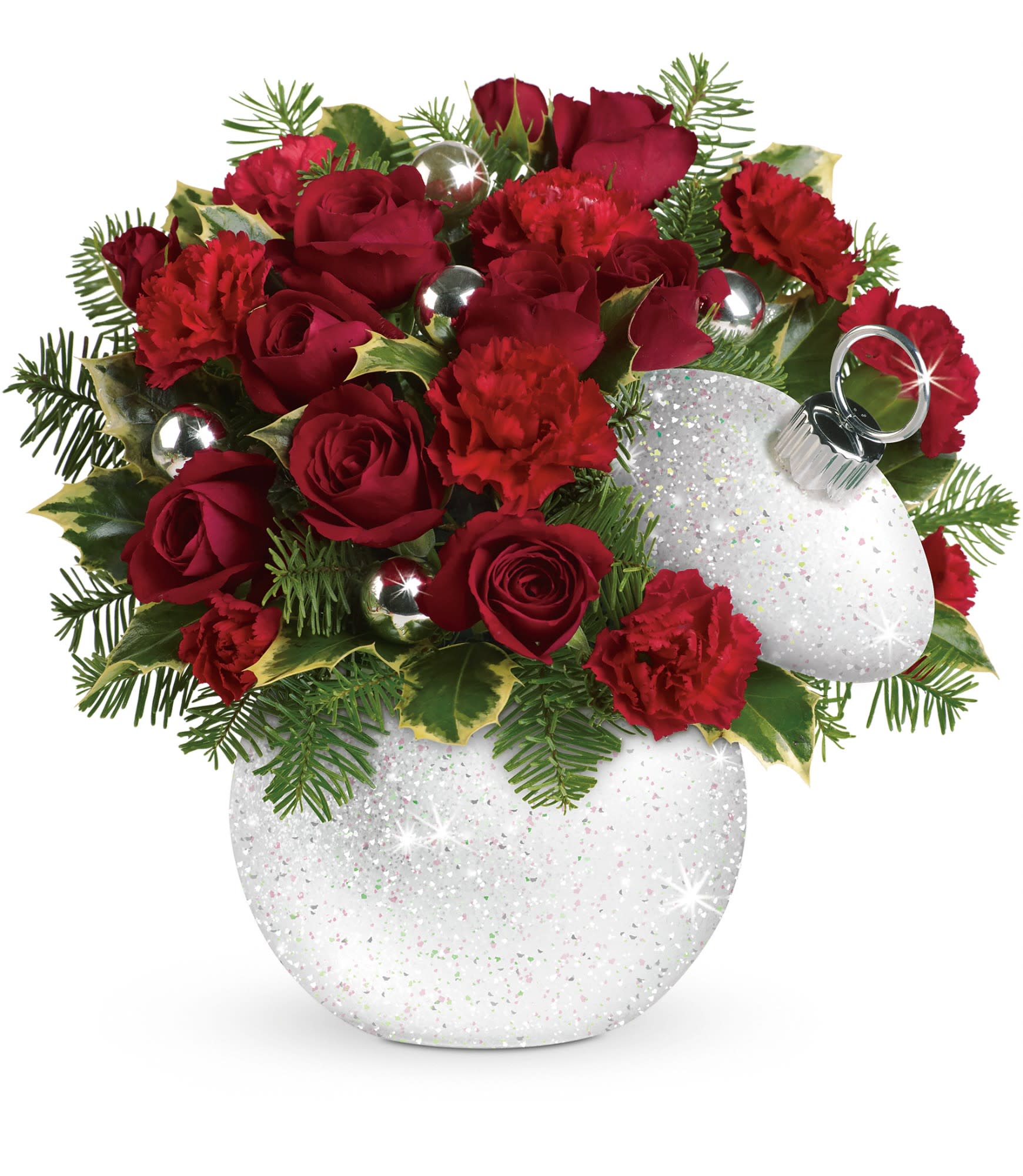 Teleflora's Shimmering Snow Bouquet - Red roses and red miniature carnations are accented with tips of holly and noble fir. Delivered in a glitter-covered Shimmering Snow ornament jar. Approximately 11 1/2" W x 10 1/2" H.  T12X400A