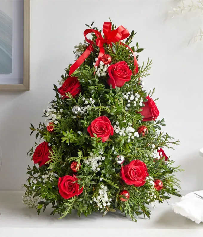 Red Christmas tree - Celebrate the season with this festive floral arrangement designed in the shape of a Christmas tree. Perfect as a centerpiece or a thoughtful gift, it brings warmth and elegance to any holiday setting.