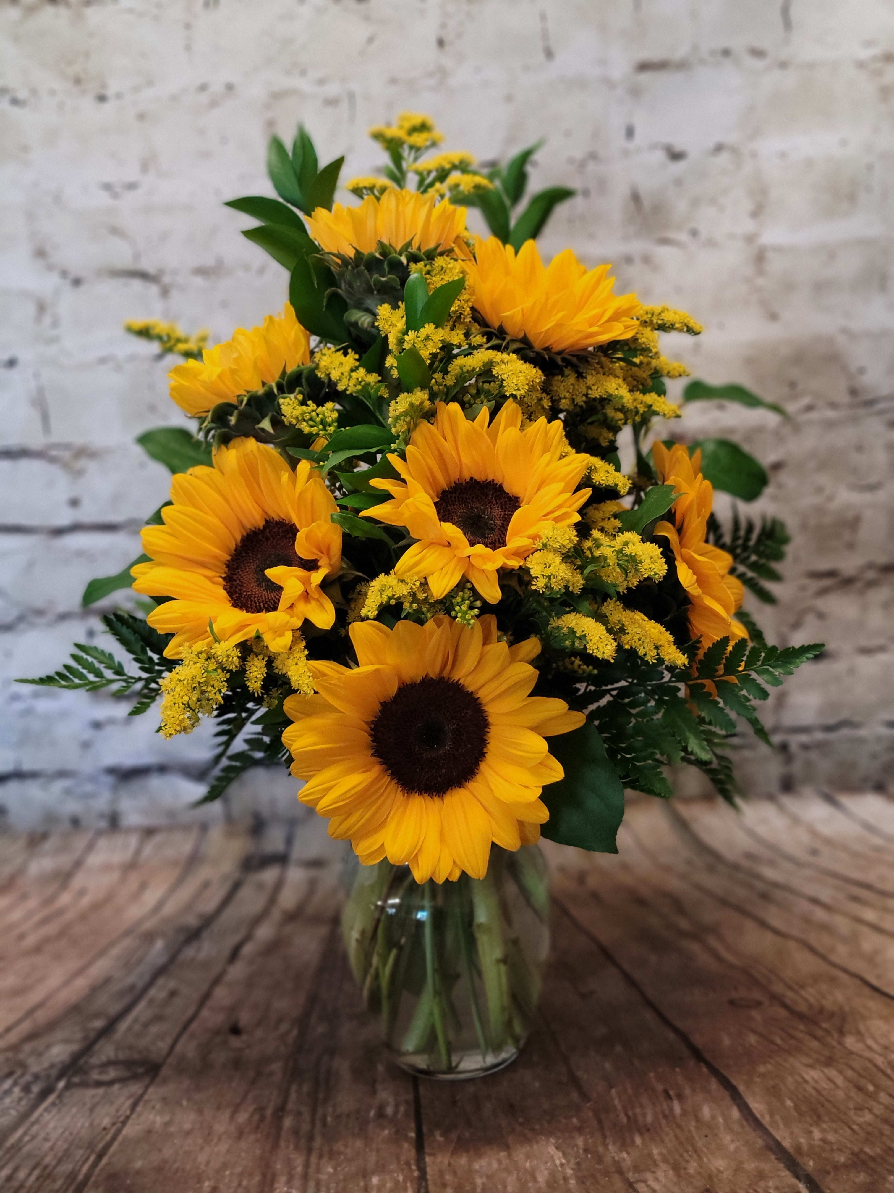 Snazzy Sunflowers - Nothing lights up a room like the golden glow of sunny sunflowers, gathered up and presented in a big bouquet. Send this generous bunch to a special friend, and you’ll be sure to receive a cheerful thank you in return!