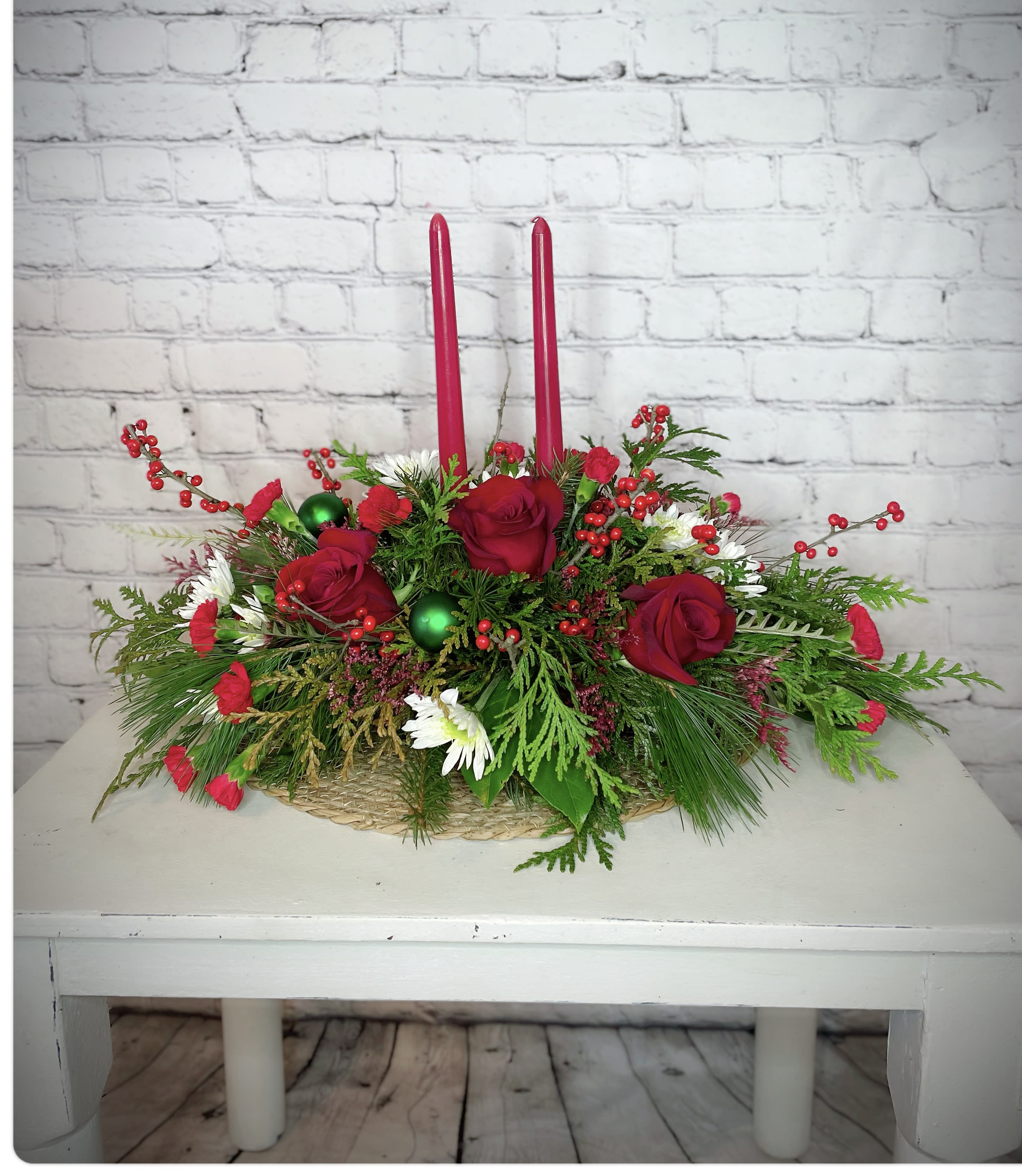 Christmas Cabin  - This rustic centerpiece will look absolutely beautiful lit up in the center of the table, adorned with red roses, winter, berry, mini carnations, and Christmas decorations. All while you make memories. 