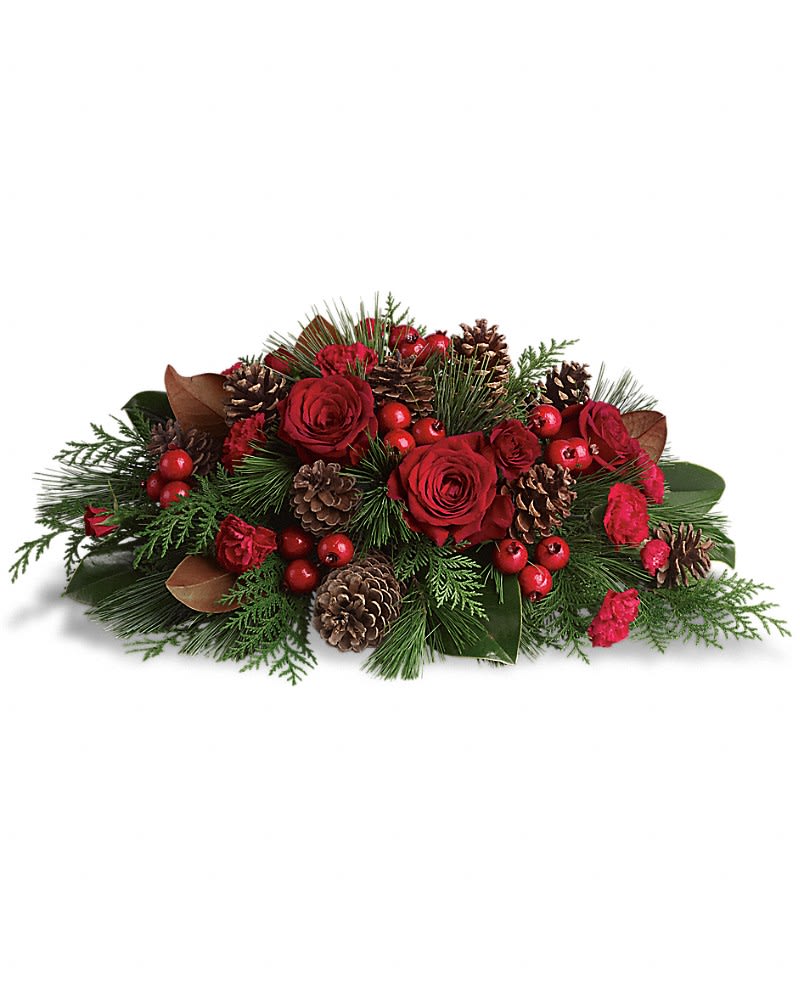 Spirit of the Season - Spread the spirit of the holiday season by sending this lovely holiday arrangement to the home of friends and family. The low profile makes it a perfect centerpiece although it will be equally at home in any room. Gorgeous red roses and spray roses berry sprays and carnations are arranged with pinecones and festive greenery. A great way to serve up holiday cheer!