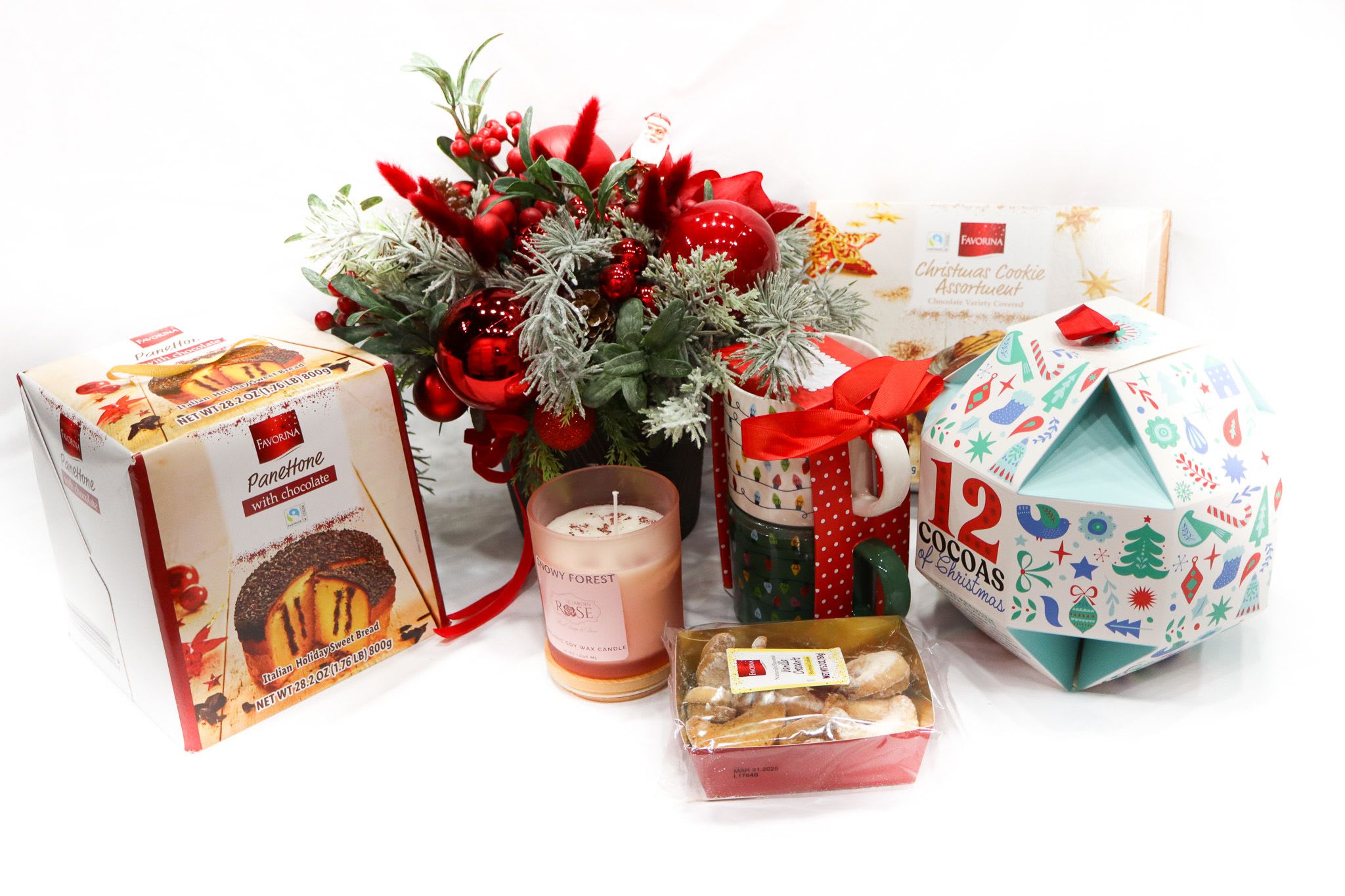 Hot Cocoa Christmas - This perfect gift basket keeps the special person in your life warm and snuggly during the winter. Inside you will find a lovely red and and gold holiday centerpiece, two Christmas mugs, a twelve hot cocoa sampler, a homemade Snowy Forest soy wax candle, vanilla cookies, and a Favorina mixed cookie box and full-size panettone - all beautifully wrapped in a basket.
