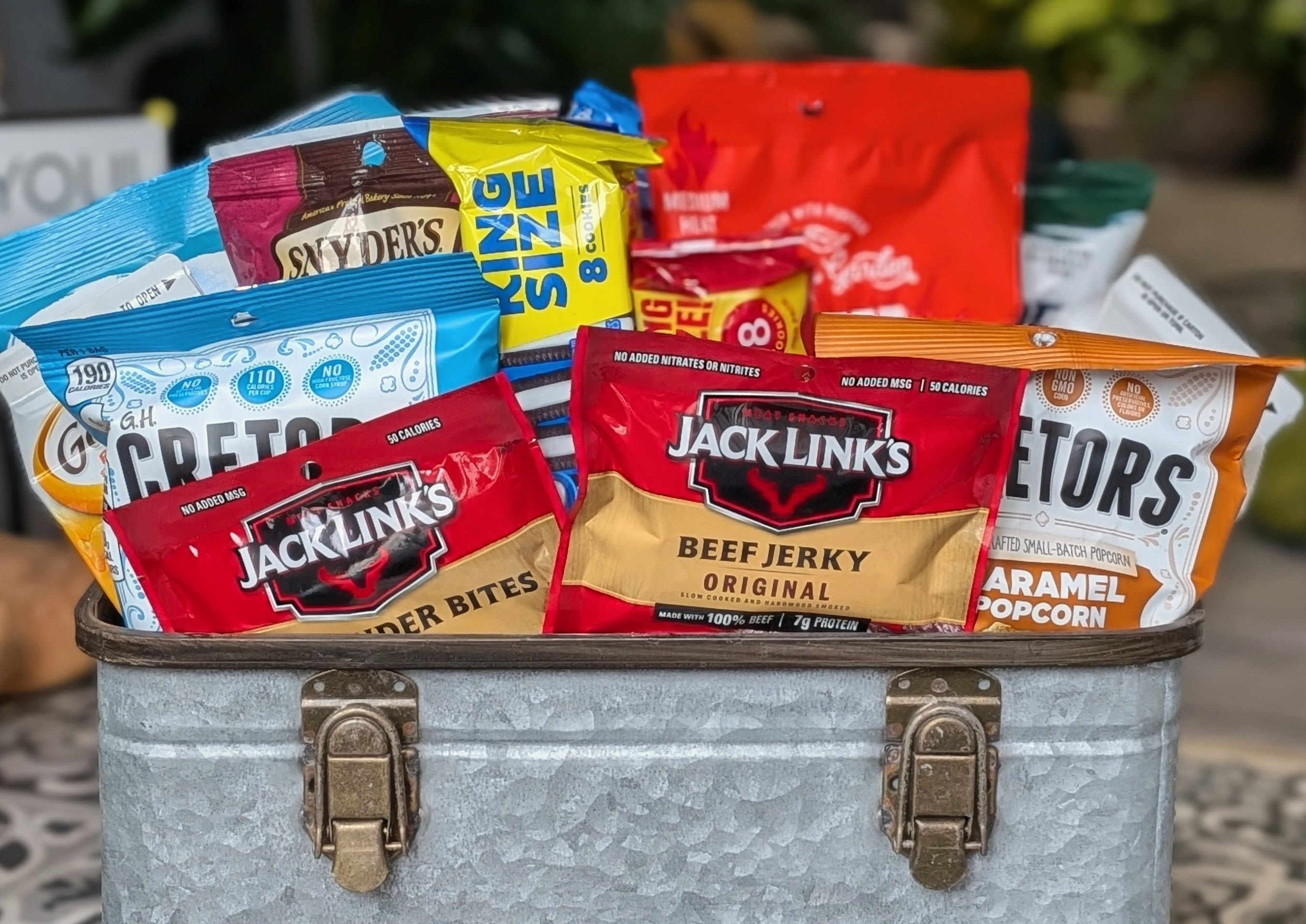Snack Box - The contents of this basket is subject to change. It can consist of chips, cookies, pretzels, popcorn, asst choc. 
