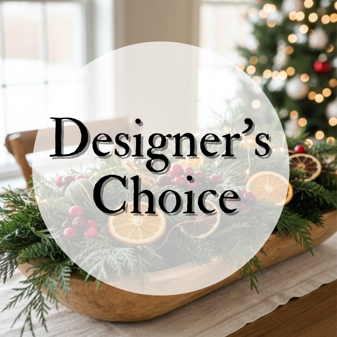 Designer's Choice - Christmas Centerpiece - Christmas Centerpiece – Designer’s Choice (Low &amp; Long) Bring effortless holiday elegance to your table with our Designer’s Choice Christmas centerpiece. This low-and-long arrangement is handcrafted by our floral designers using the freshest seasonal blooms, lush winter greens, and festive accents. Perfectly styled for dining tables, buffets, or mantels, its elongated shape creates a beautiful, unobtrusive display that enhances your holiday décor without blocking conversation. Each piece is unique, artfully composed to capture the warmth, sparkle, and spirit of the season.