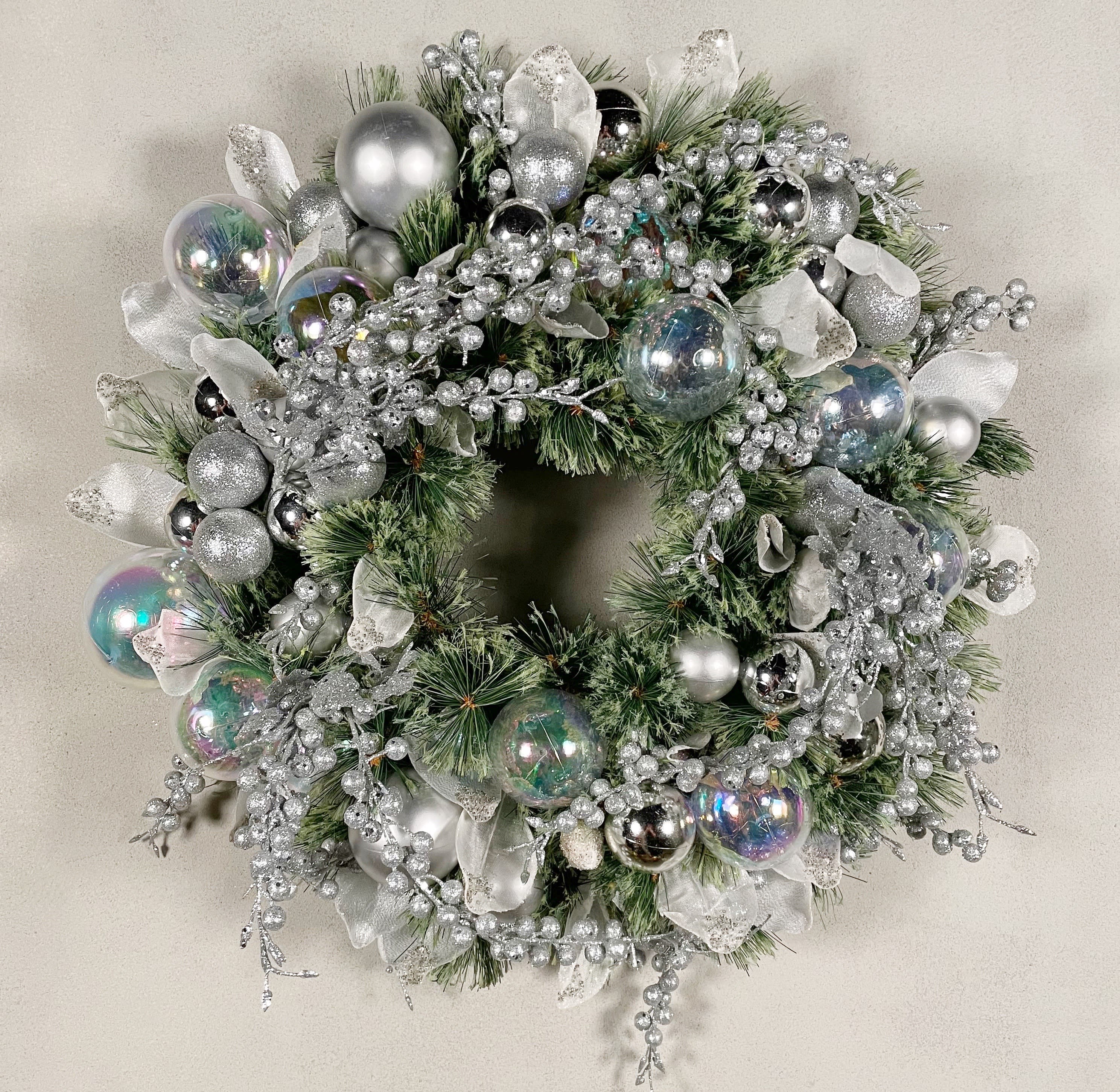 Holiday Wreath Silver Bells - A holiday wreath decked with silver bells and iridescent globes.  If you're interested in a matching centerpiece for your table (see third photo), please contact us for a quote!