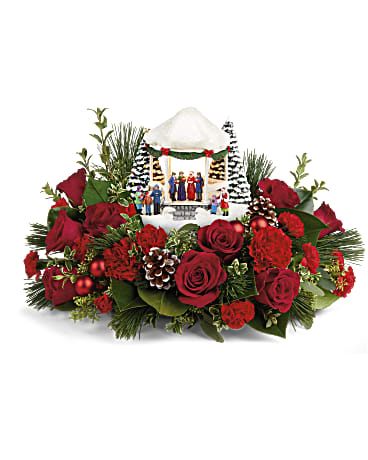 THOMAS KINKADE'S SOUNDS OF CHRISTMAS - Here's something to sing about! This charming, hand-painted Thomas Kinkade collectible is nestled in festive red roses and winter greens for an unforgettable gift. The classic caroling scene lights up for extra holiday fun