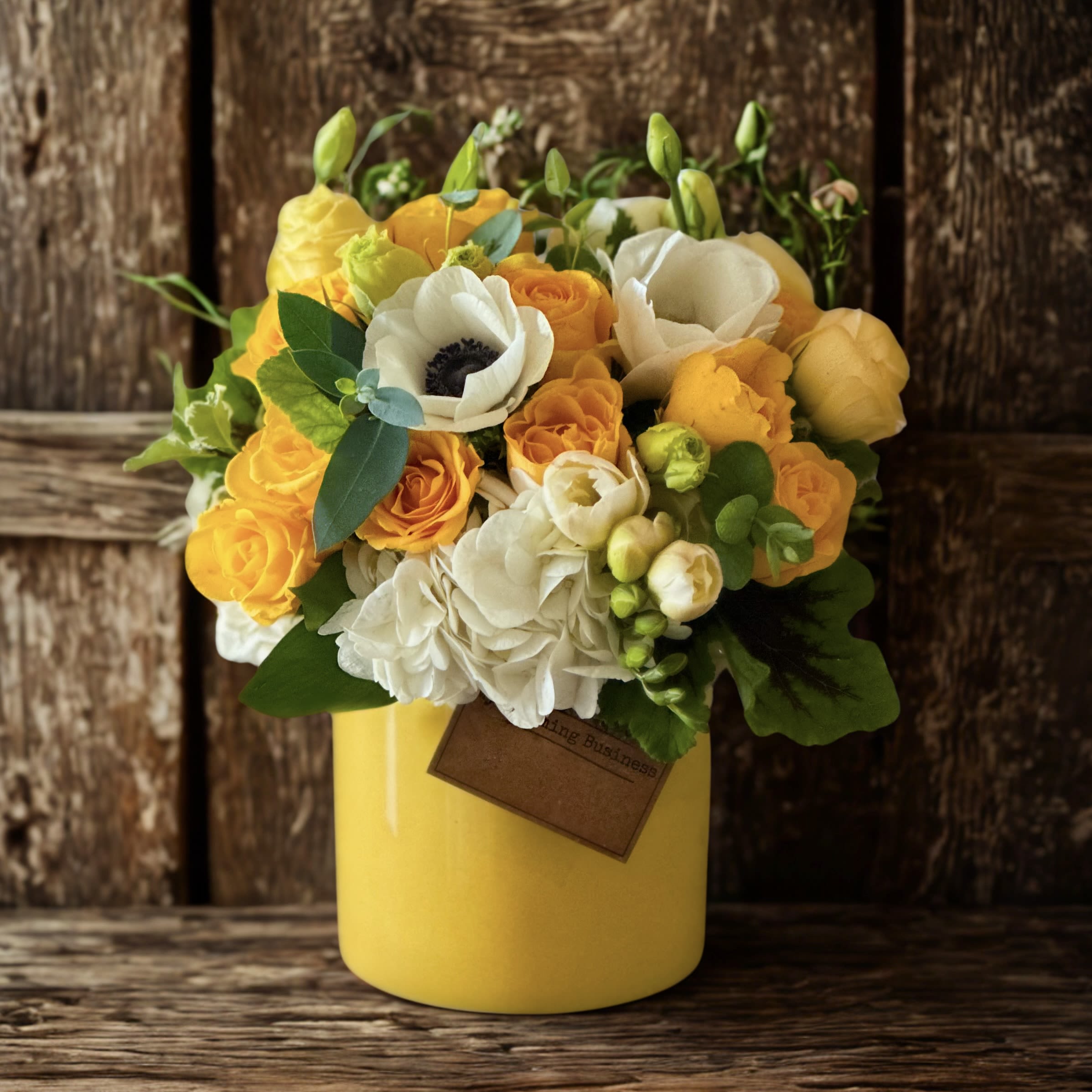 A Little Cheer Me Up Arrangement – by My Blooming Business - A Little Cheer Me Up Arrangement – by My Blooming Business Brighten someone's day with our A Little Cheer Me Up arrangement, thoughtfully designed to lift spirits and spread joy. This charming floral display features fluffy white hydrangeas, cheerful yellow roses, and elegant white anemones—creating a fresh and soothing color palette.  Expertly arranged in a yellow ceramic vase, it's perfect for get-well wishes, thinking-of-you moments, or simply bringing a little sunshine into any space.  Top-rated florist in Los Angeles, highly reviewed on Google, Yelp, and BloomNation. We proudly deliver across Los Angeles, the San Fernando Valley, and the San Gabriel Valley.