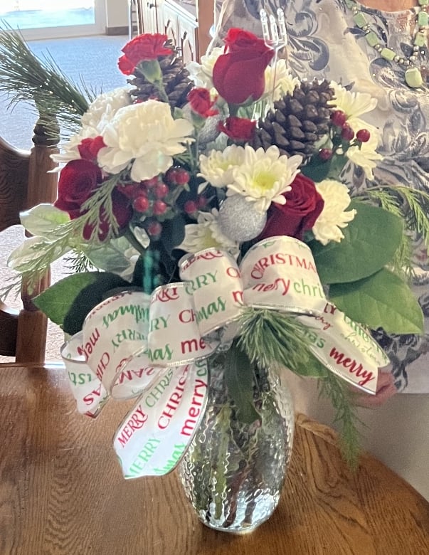 Christmas Designers Choice - Send your Merry Christmas wishes with one of our designers choice arrangements in red white and green with a bow!  Bow ribbon pattern may very. 