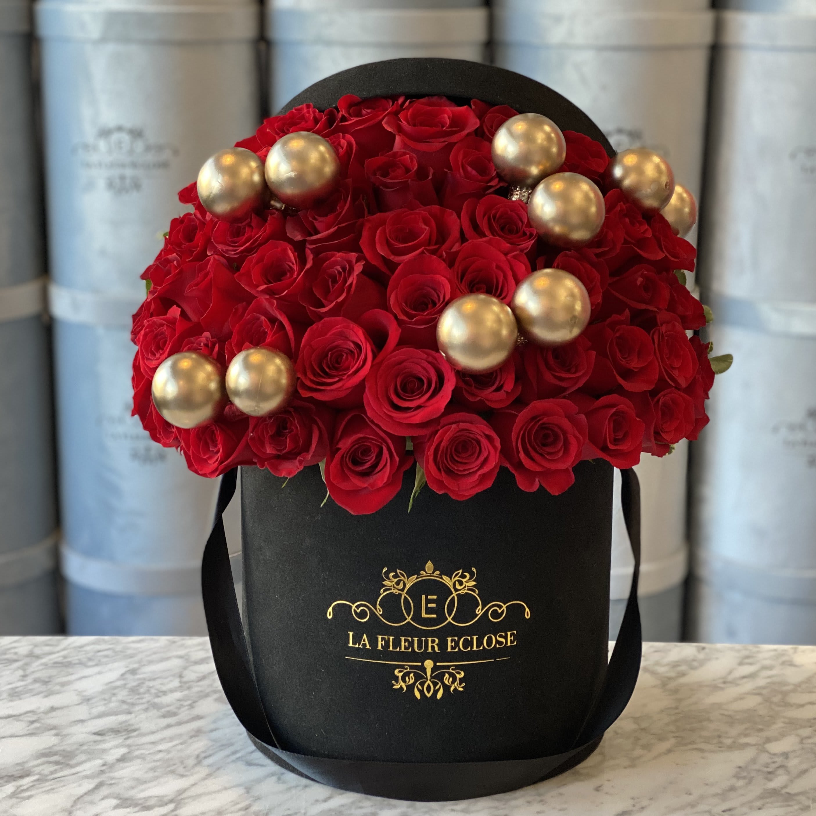 Christmas is Coming - Standard 75 red roses in our signature black box with Christmas Ornaments  Deluxe 100 red roses in our signature black box with Christmas Ornaments Premium 150 red roses in our signature black box with Christmas Ornaments