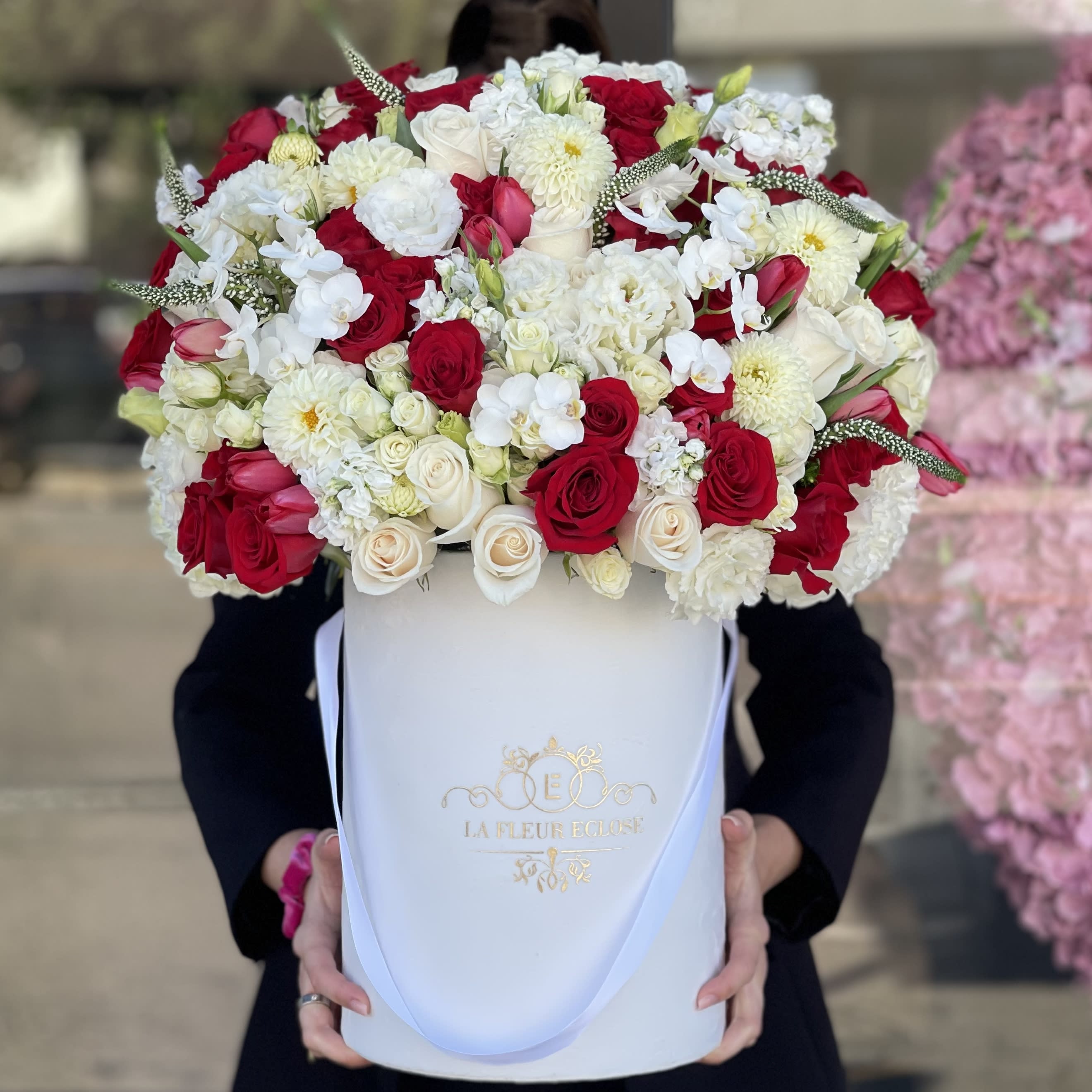 Christmas Collection - Beautiful arrangement in our white velvet with mix flowers with christmas color             Standard – pictured  Deluxe – the amount of flower will be bigger. We will also put more premium flowers into the arrangement. Premium – the box size will be changed for the bigger one and a lot of premium flowers will be added to the arrangement. 