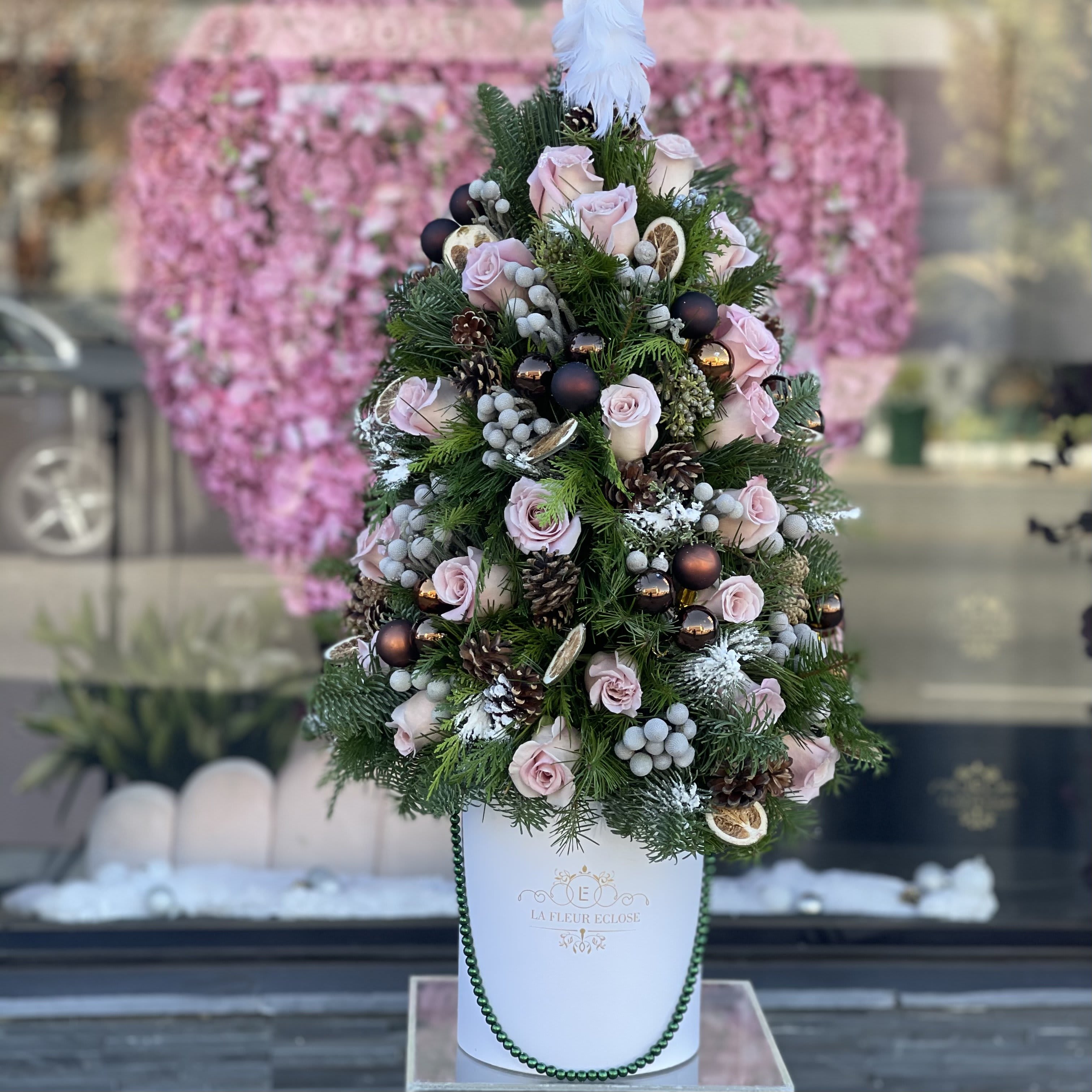 Christmas Is Here - Christmas tree with pink flowers and ornaments 