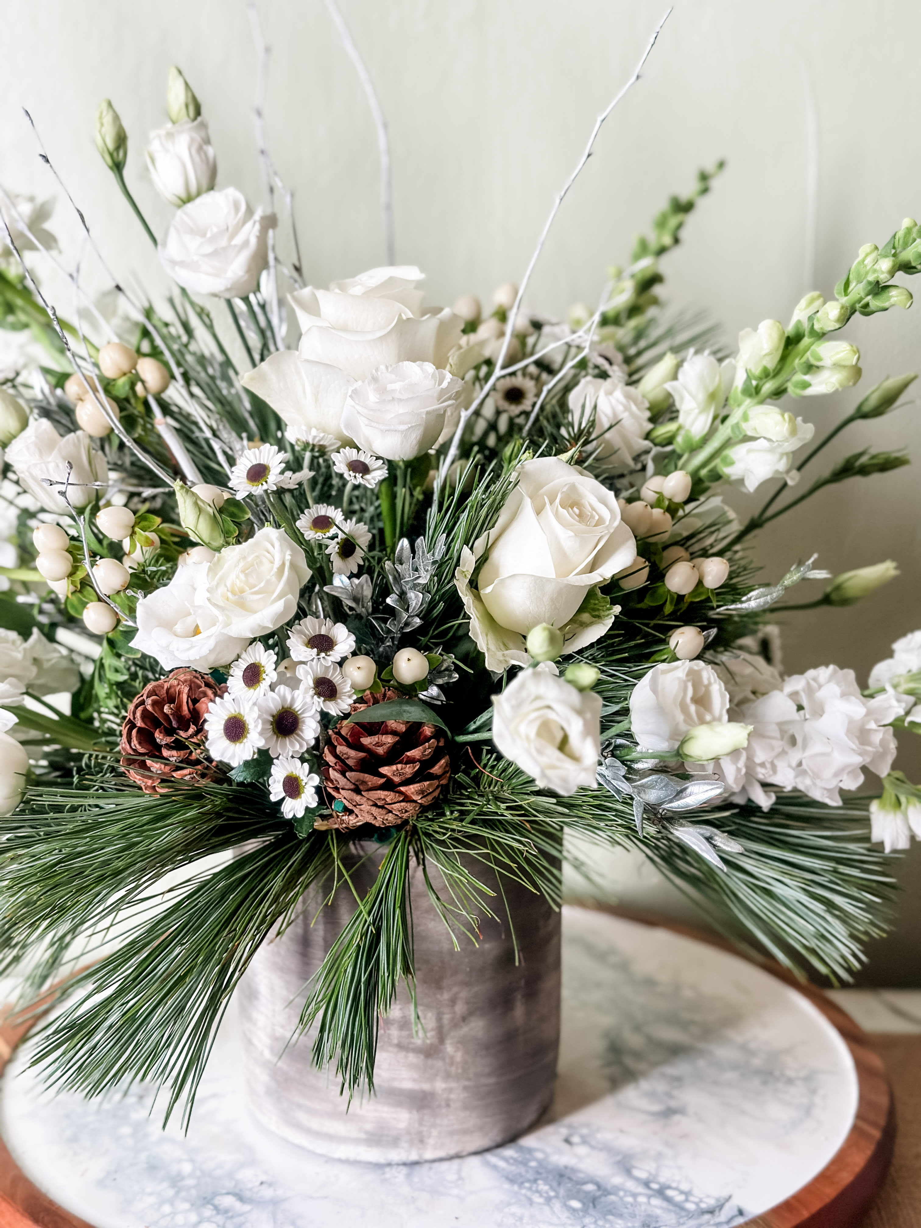 Sweater Weather - All white florals and mix of fresh cut winter greens in a heavy ceramic vase that can be repurposed as a vase or even a hand