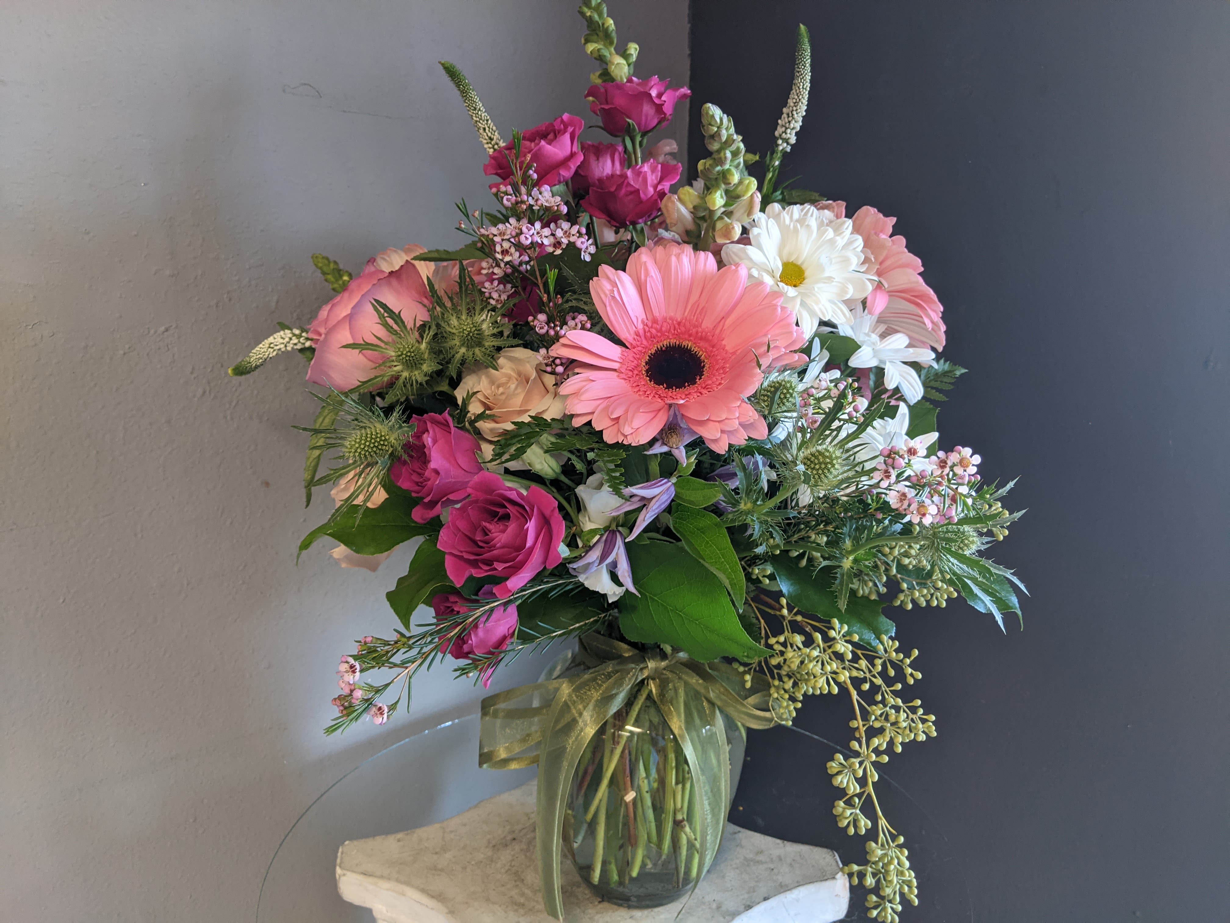 # 142 Winter Floral Arrangement - A beautifully selected bunch of the freshest flowers in a vase uniquely arranged by hand.