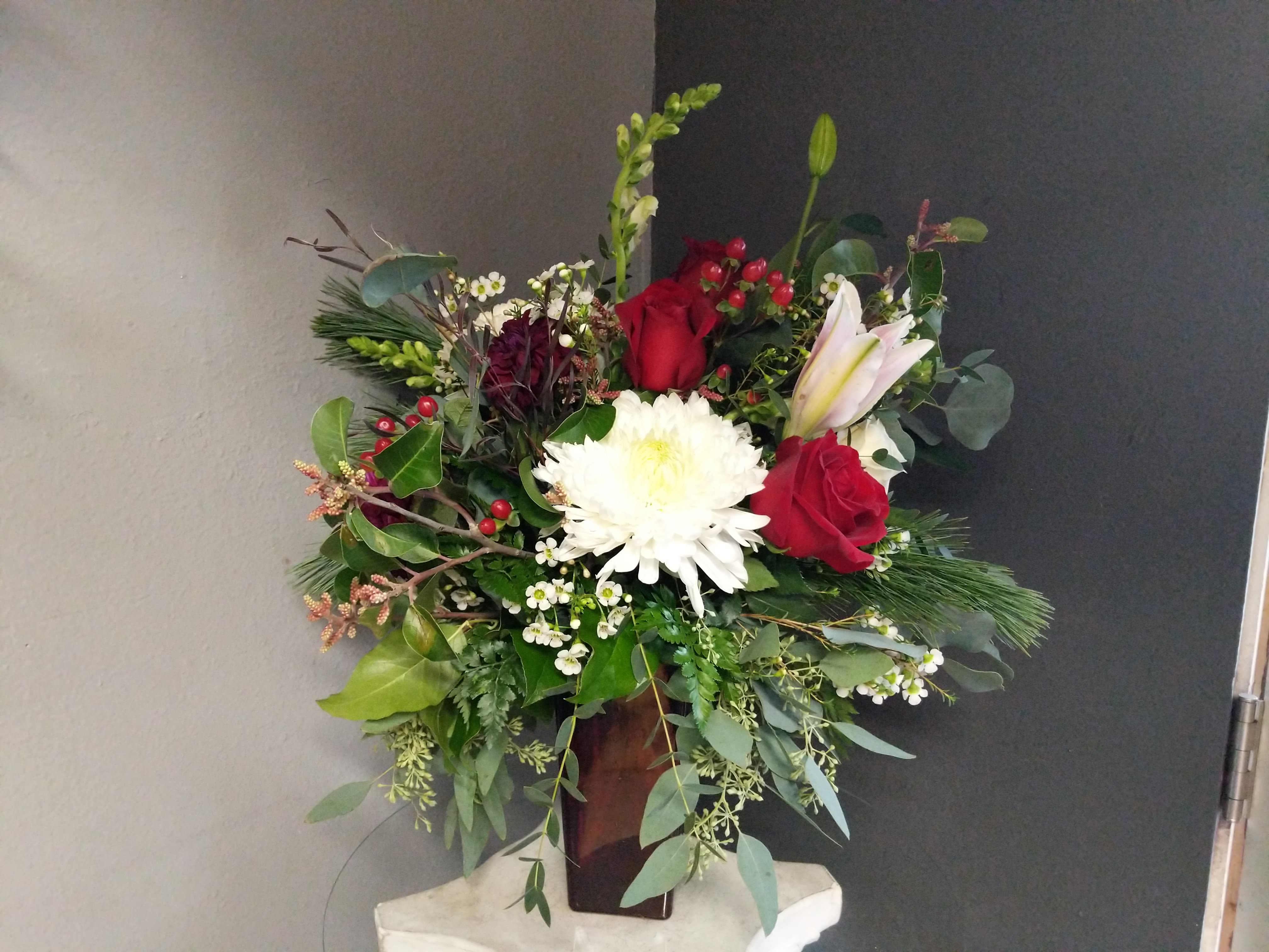 # 139 Winter Floral Arrangement - A beautiful one of a kind arrangement made with fresh flowers in a vase!