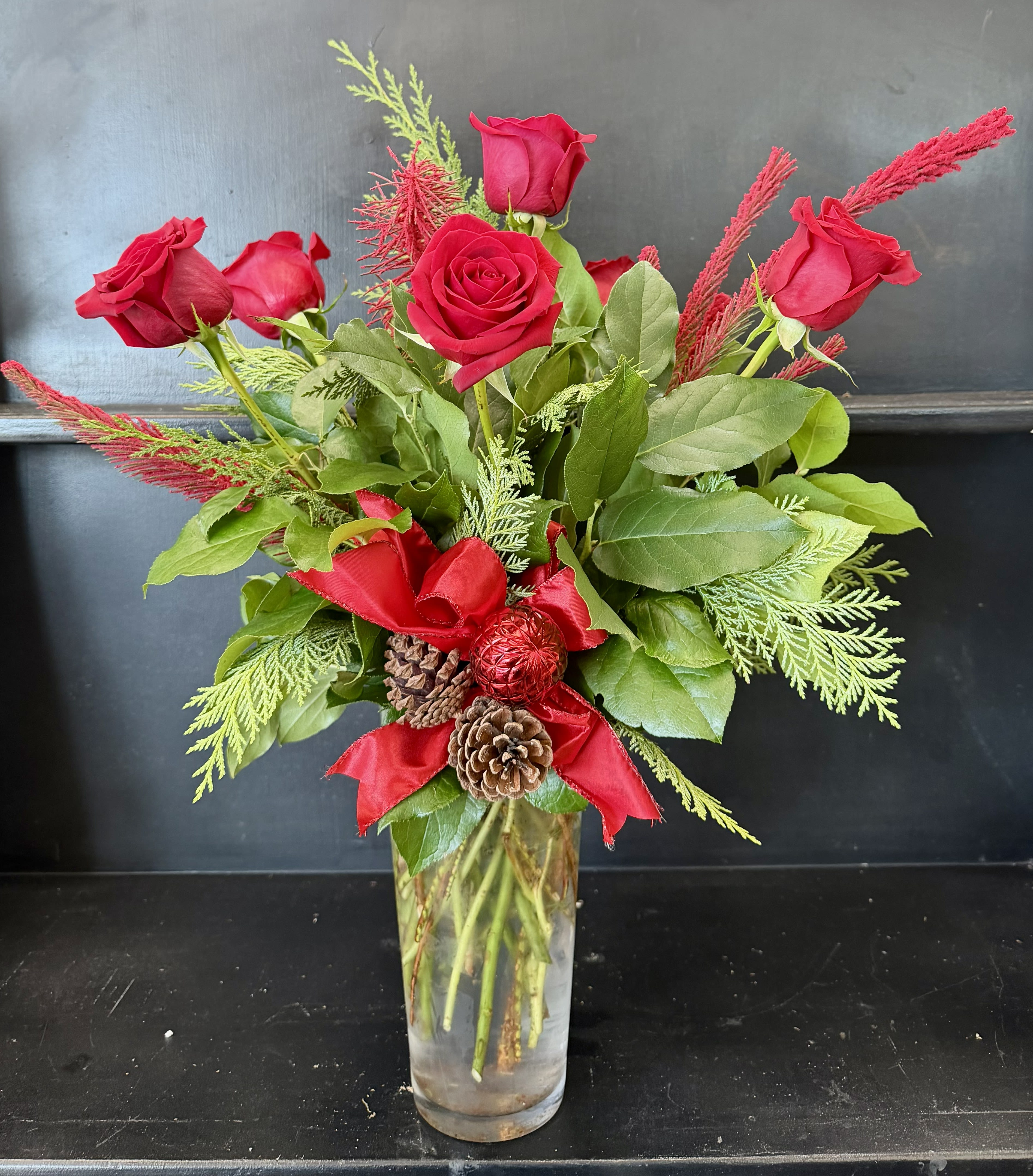 Half way to Christmas - Our Half dozen red roses with Christmas greens