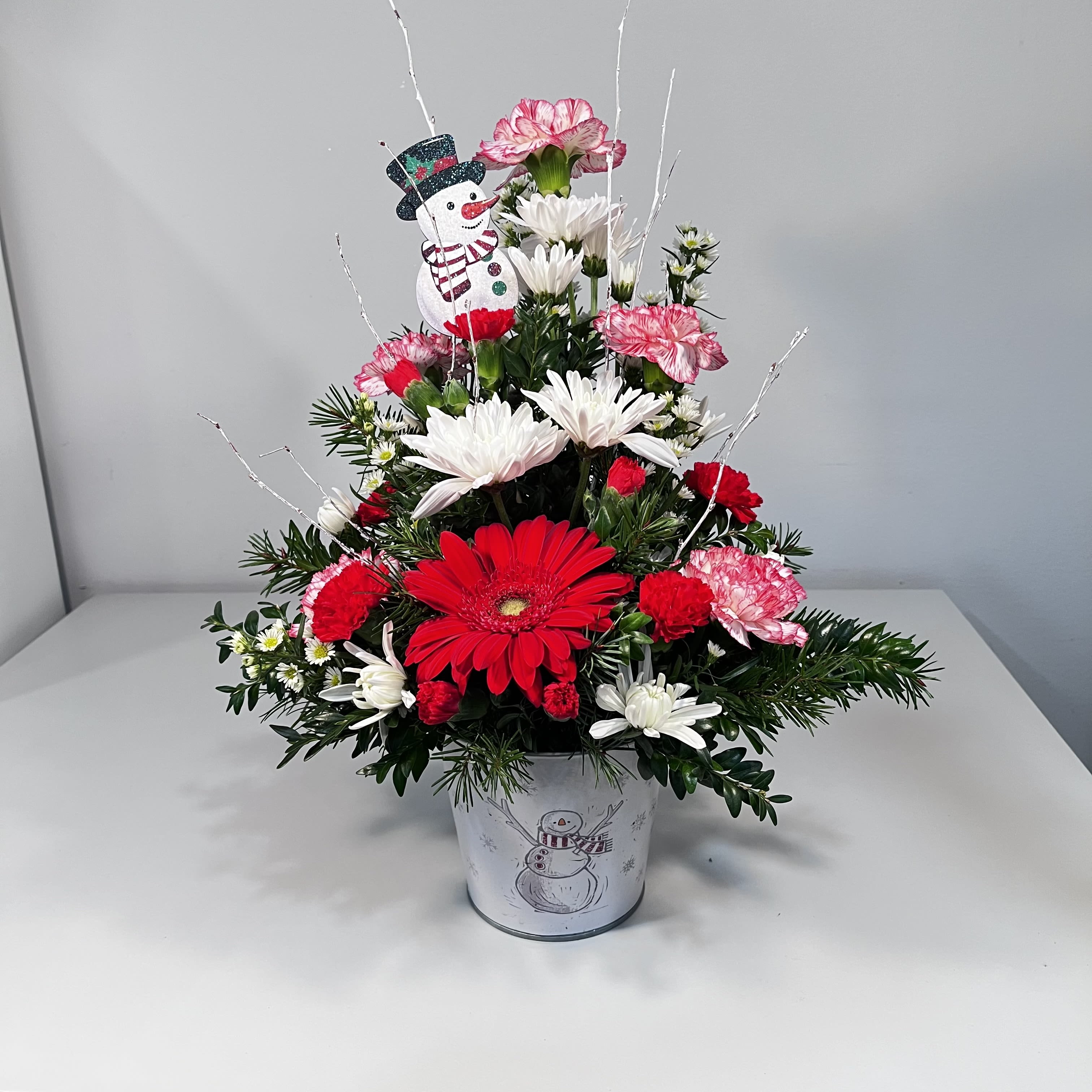 Frosty Snowman - Snowman Tin Pot Filled with Seasonal Mixed Green and Flowers (Flowers may differ due to availability)