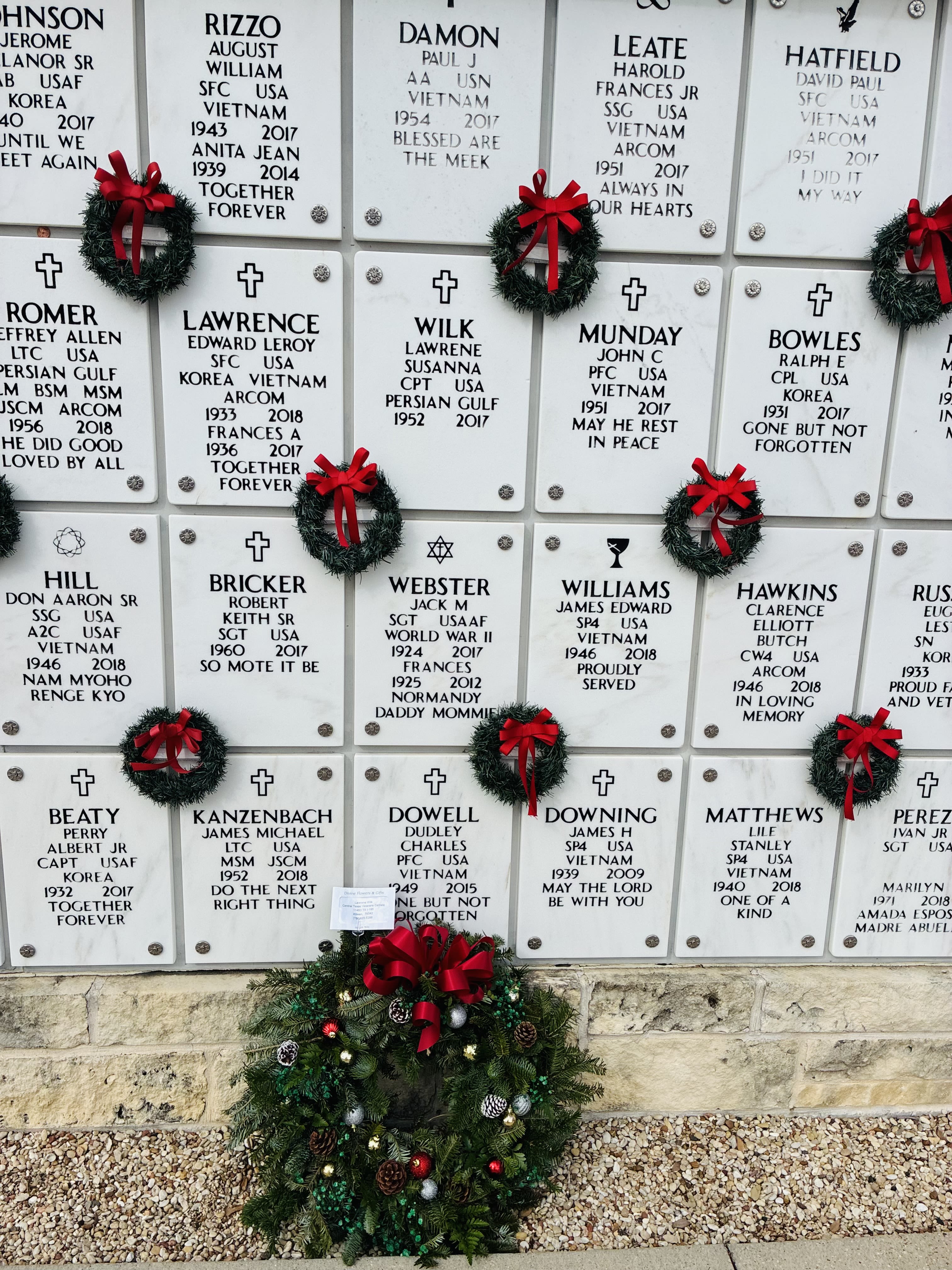 Christmas cemetery wreath  -  Honor the memory of a beloved soul with this elegant Christmas wreath, thoughtfully crafted to bring comfort and holiday warmth to their resting place. Lush evergreens are shaped into a classic wreath and adorned with seasonal touches such as rich red berries, festive ornaments, and a beautifully tied holiday bow. Accents of pinecones and soft winter greenery add a peaceful, natural charm. This meaningful tribute offers a gentle reminder that love endures through every season, bringing a touch of Christmas spirit to honor and remember someone deeply missed.