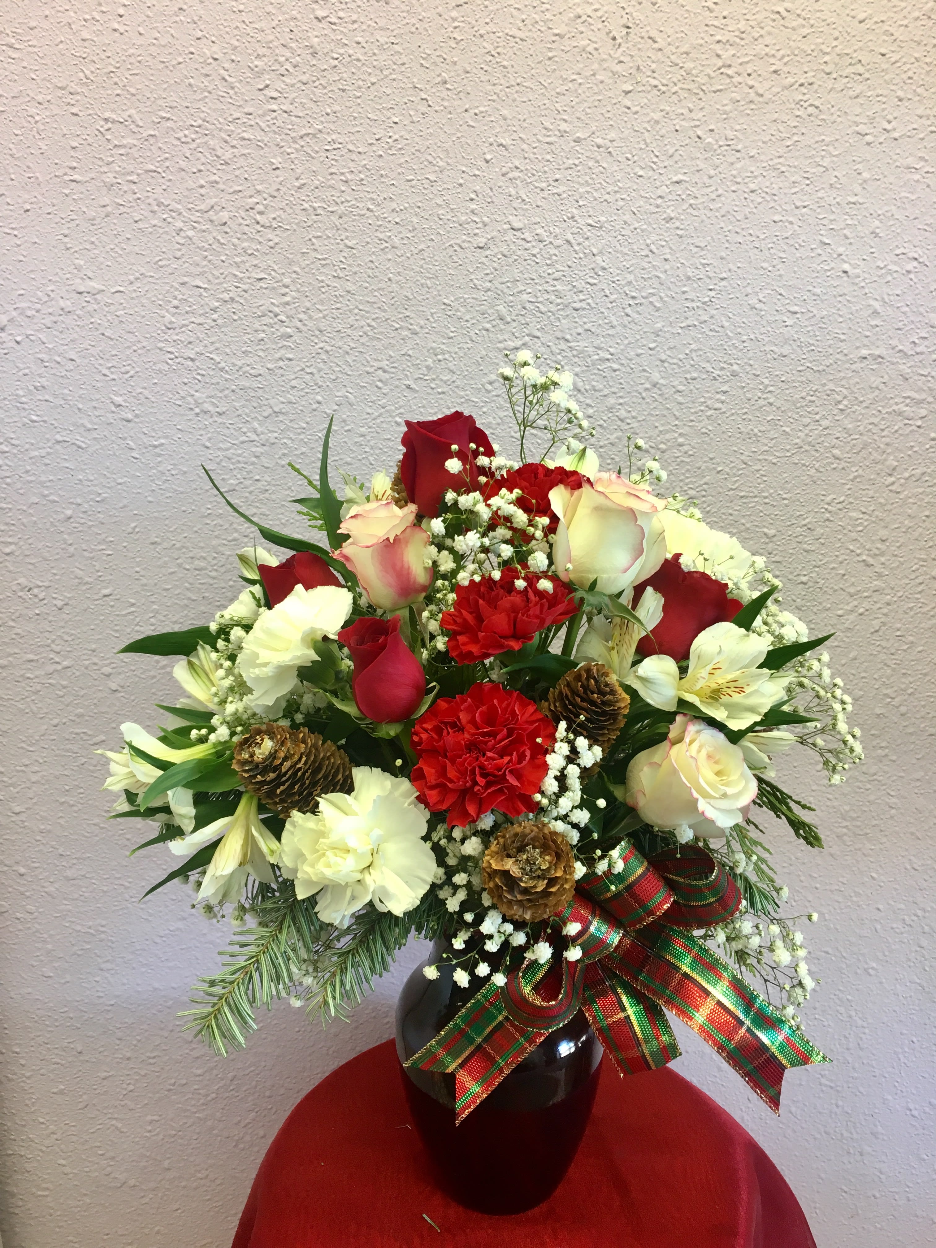 Colorado Christmas by Forever Flowers - A compact arrangement, great for the holidays.  Contains white roses, white carnations, red carnations, greens, etc. 