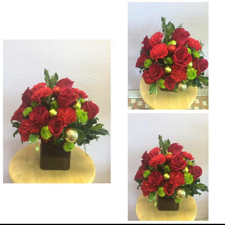 Under the Mistletoe by Forever Flowers - This mix of red and green is sure to enhance your holiday this year!