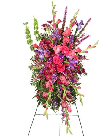 Cherished Memories by FSN - Contains pink gladiolus, purple iris, pink roses, bells of Ireland, liatris, purple larkspur, purple statice, pink calycina, fuchsia daisy poms. 