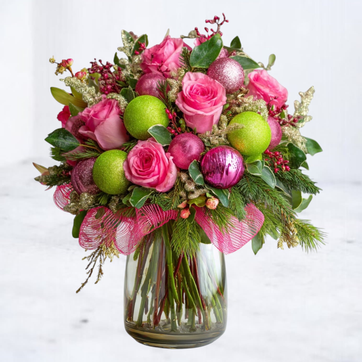 Merry Pop - Bright, bold, and bursting with holiday cheer — the Merry Pop Bouquet is your go-to festive showstopper for anyone who loves a modern twist on Christmas blooms. Designed in a clear glass vase and filled with lush evergreens, vivid pink roses, sparkling ornaments, and playful pops of lime green, this holiday arrangement delivers pure joy in color form.  Every stem is styled to create that signature Whiskey Wallflower mix of luxe meets fun: vibrant roses, festive baubles, and holiday textures layered into a full, rounded silhouette. Whether you’re sending a gift or decorating your Christmas table, this bouquet instantly lifts the room with a punchy, contemporary holiday vibe.  Perfect for holiday parties, festive birthdays, girls’ night décor, Secret Santa surprises, office gifting, and anyone who loves color-forward Christmas décor.  Now available for same-day holiday flower delivery in Galveston, Jamaica Beach, Tiki Island, Sea Isle, Hitchcock, La Marque, Santa Fe, Texas City, League City, Dickinson, Kemah, Clear Lake, Webster, and surrounding coastal communities along Galveston Bay.  Substitution Disclaimer Due to seasonal availability, some blooms or accents may be replaced with similar premium varieties of equal or greater value to maintain the design’s look and integrity. Your arrangement will always reflect the same spirit, palette, and premium quality.