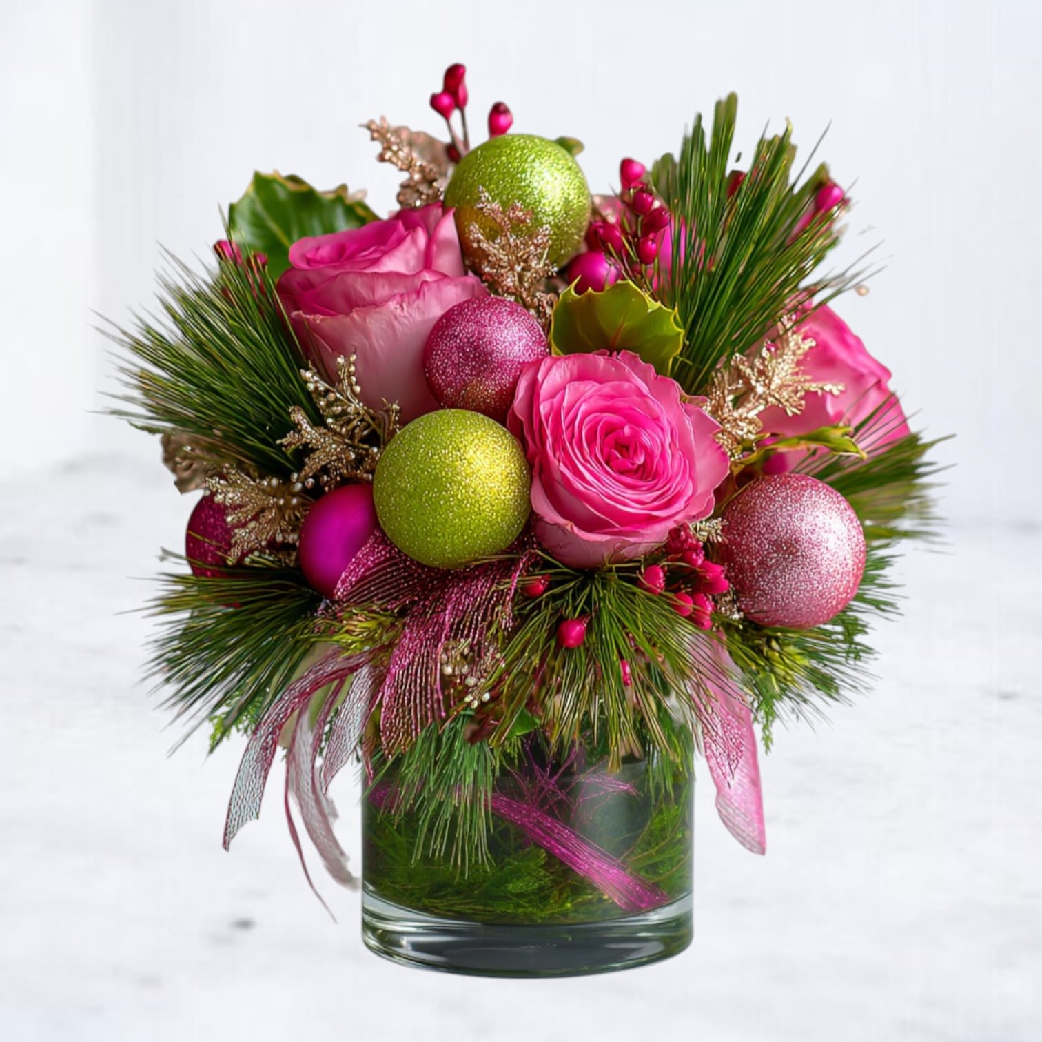 Mini Merry Pop - Bright, playful, and packed with festive personality — the Mini Merry Pop brings big holiday cheer in a compact, giftable size. Bursting with vibrant pink roses, sparkling lime and fuchsia ornaments, and lush winter greenery, this modern Christmas arrangement is designed in a sleek clear glass vase with decorative ribbon accents.  It’s the perfect way to send a joyful pop of color without going oversized — ideal for desks, side tables, teacher gifts, hostess presents, or anyone who loves bold, non-traditional holiday décor.  Now available for same-day holiday flower delivery in Galveston, Jamaica Beach, Tiki Island, Sea Isle, Hitchcock, La Marque, Santa Fe, Texas City, League City, Dickinson, Kemah, Clear Lake, Webster, and surrounding coastal communities along Galveston Bay.  Substitution Disclaimer Due to seasonal availability, some blooms or accents may be replaced with similar premium varieties of equal or greater value to maintain the design’s look and integrity. Your arrangement will always reflect the same spirit, palette, and premium quality.  